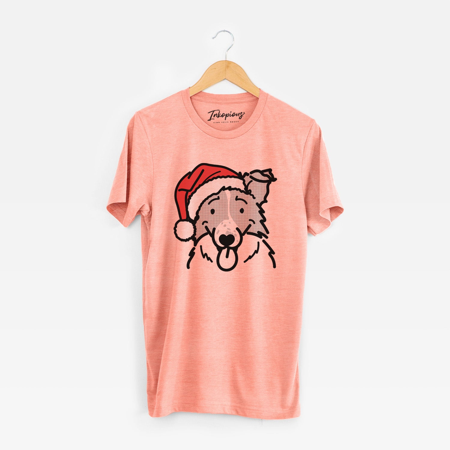 Minimalist line drawing of Jam the Border Collie wearing a Santa hat on a Sunset Unisex crewneck