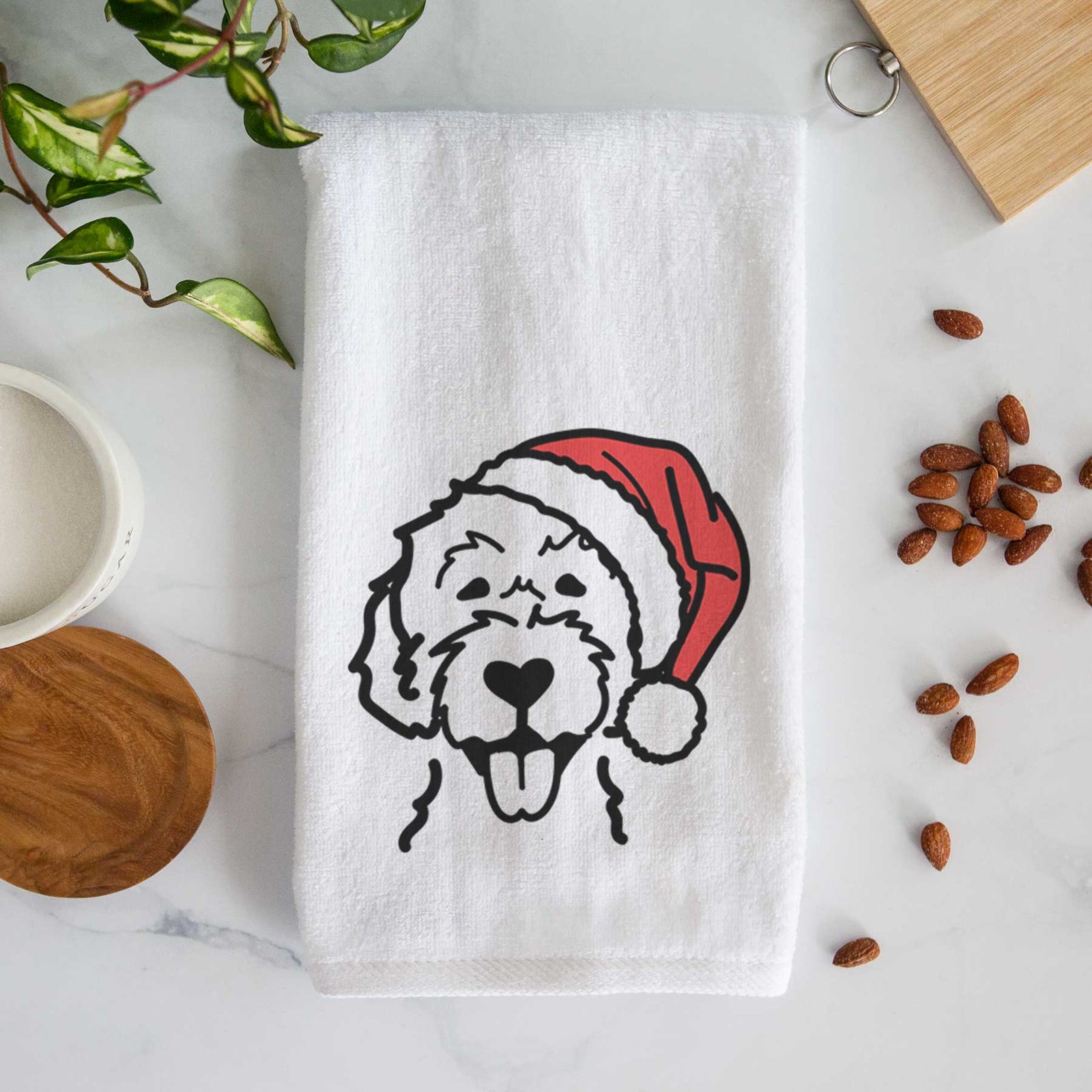 Minimalist line drawing of a Labradoodle wearing a Santa hat on a decorative hand towel