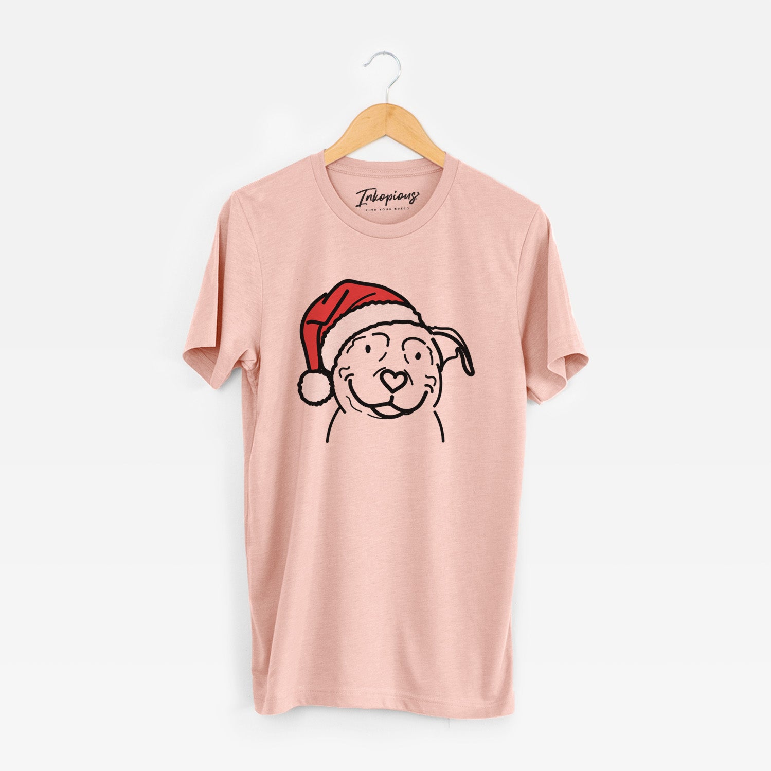 Minimalist line drawing of Lady the American Pitbull Terrier wearing a Santa hat on a Peach Unisex crewneck