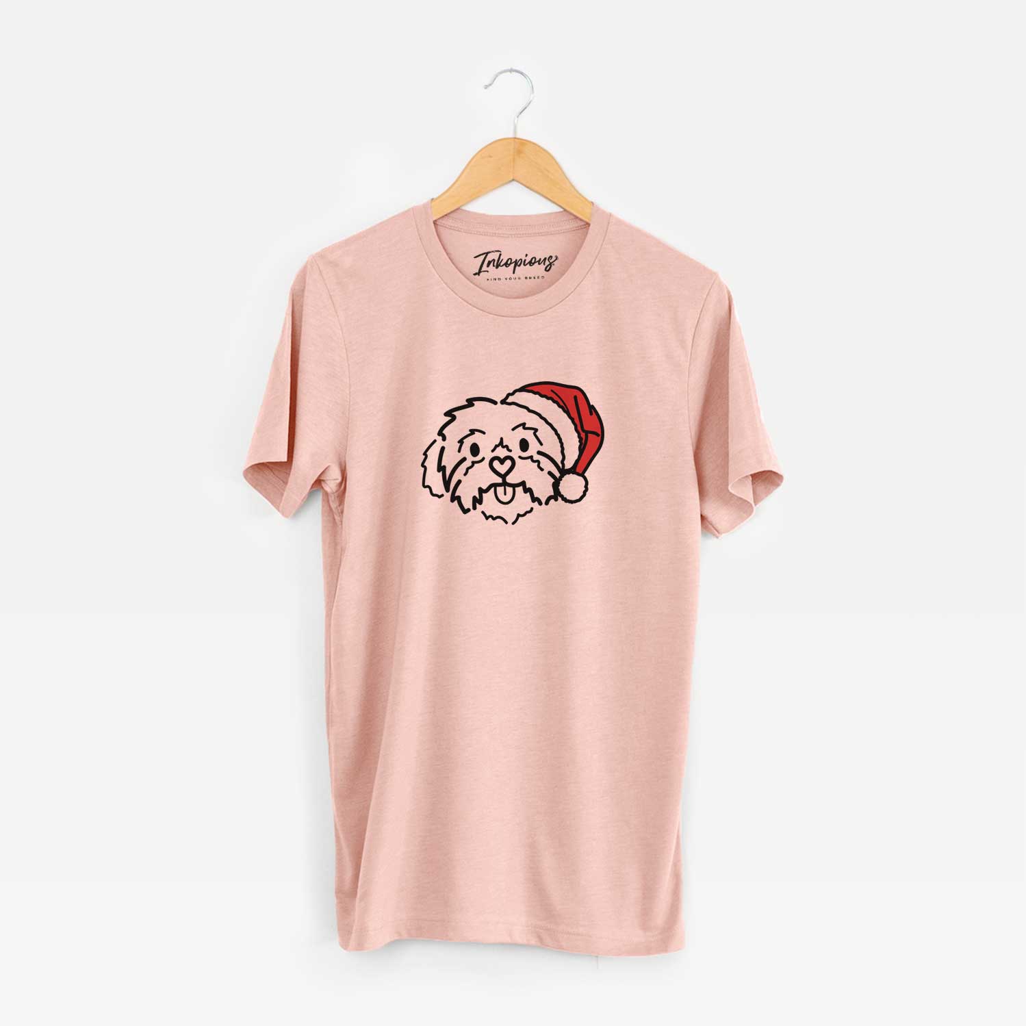 Minimalist line drawing of Leo the Shih Tzu wearing a Santa hat on a Peach Unisex crewneck