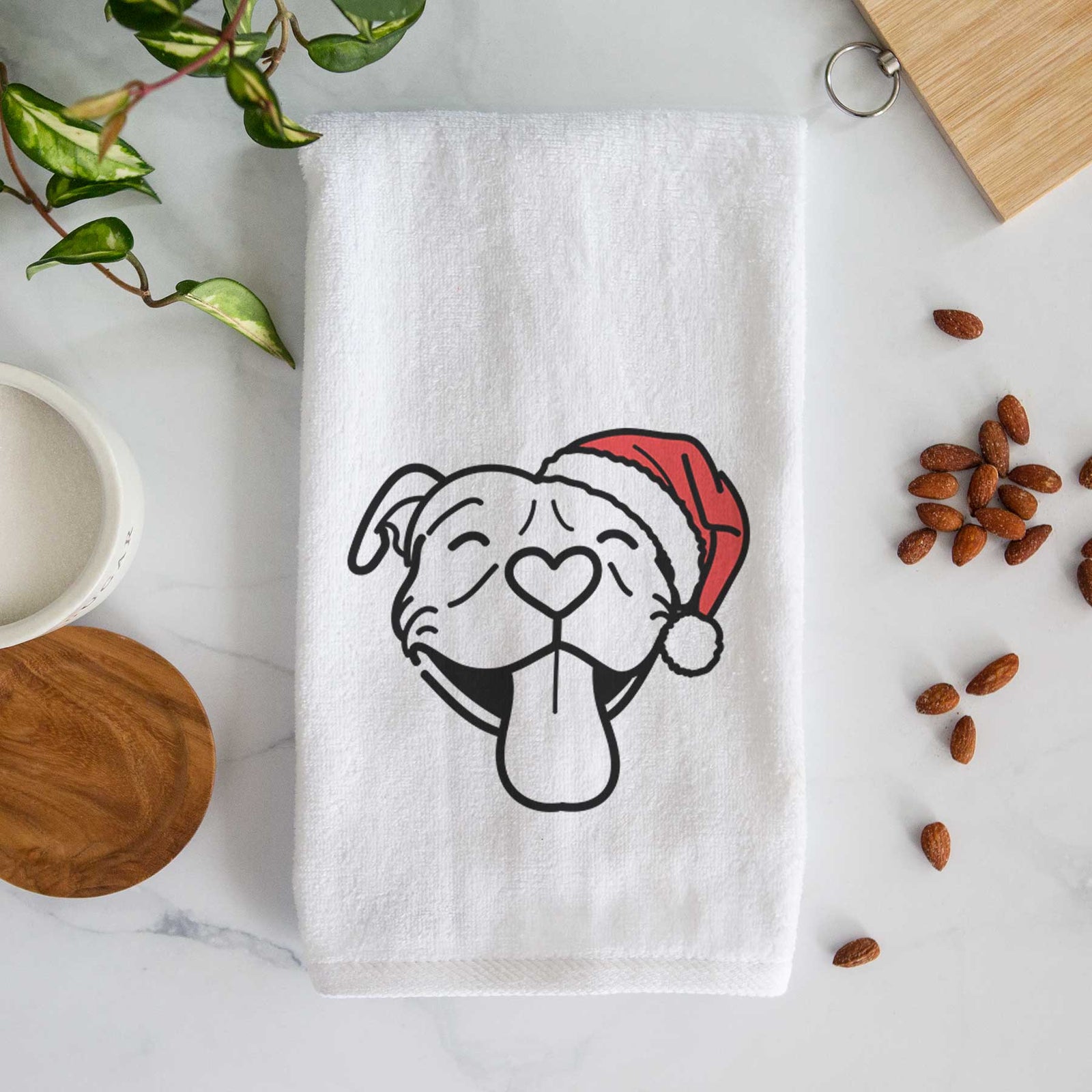 Minimalist line drawing of Louie the Pitbull wearing a Santa hat on a decorative hand towel