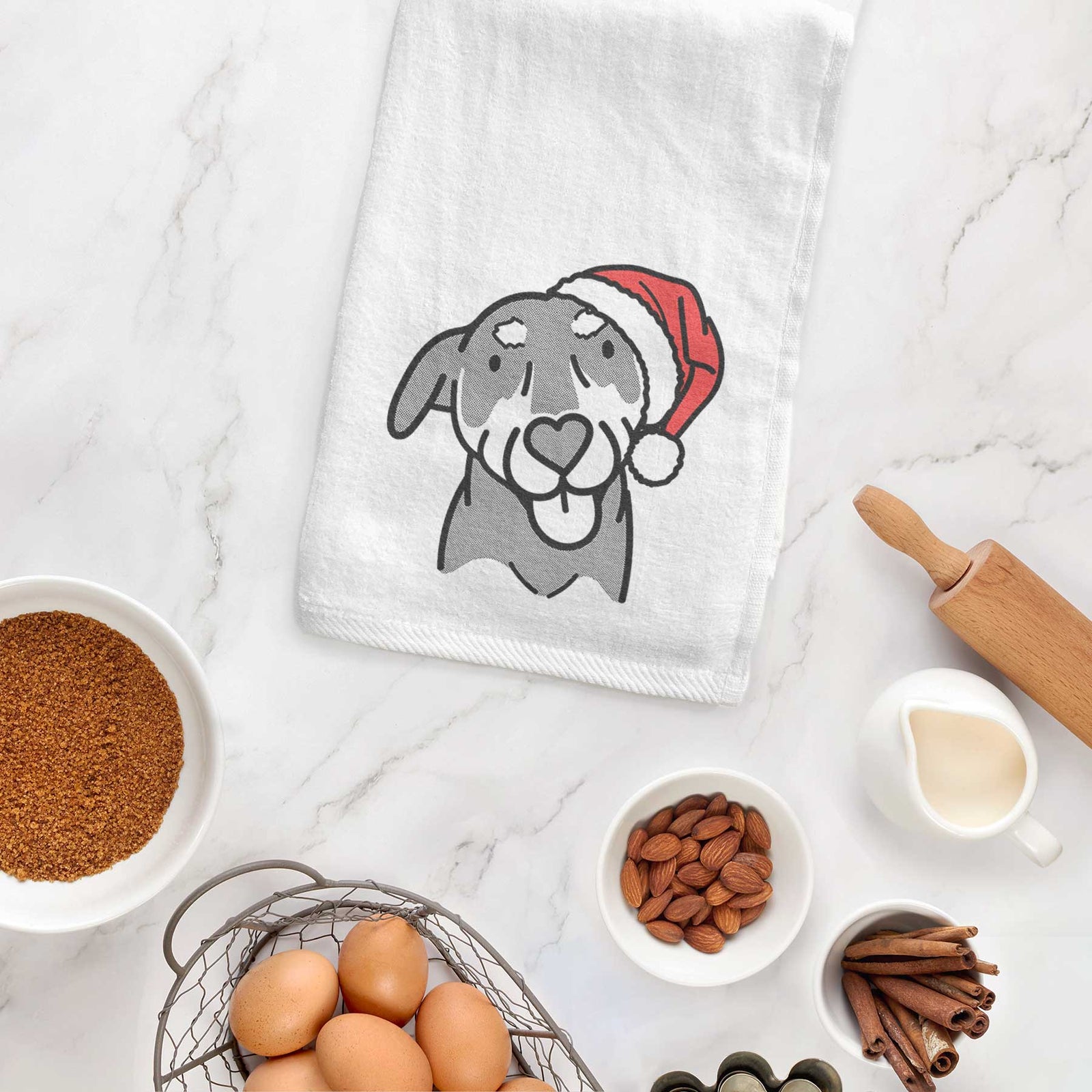 Minimalist line drawing of Lousia the Mixed Breed wearing a Santa hat on a decorative hand towel