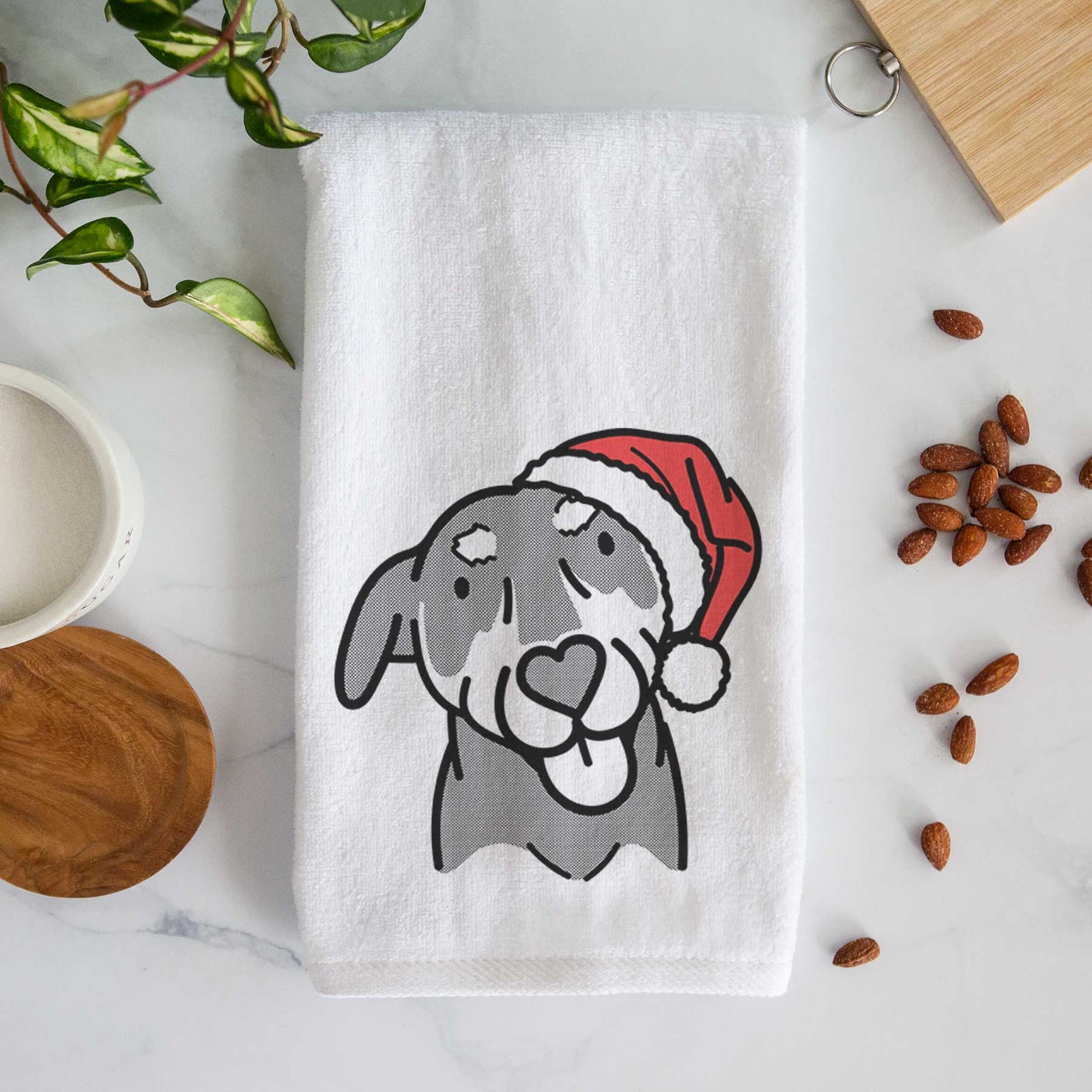 Minimalist line drawing of Lousia the Mixed Breed wearing a Santa hat on a decorative hand towel