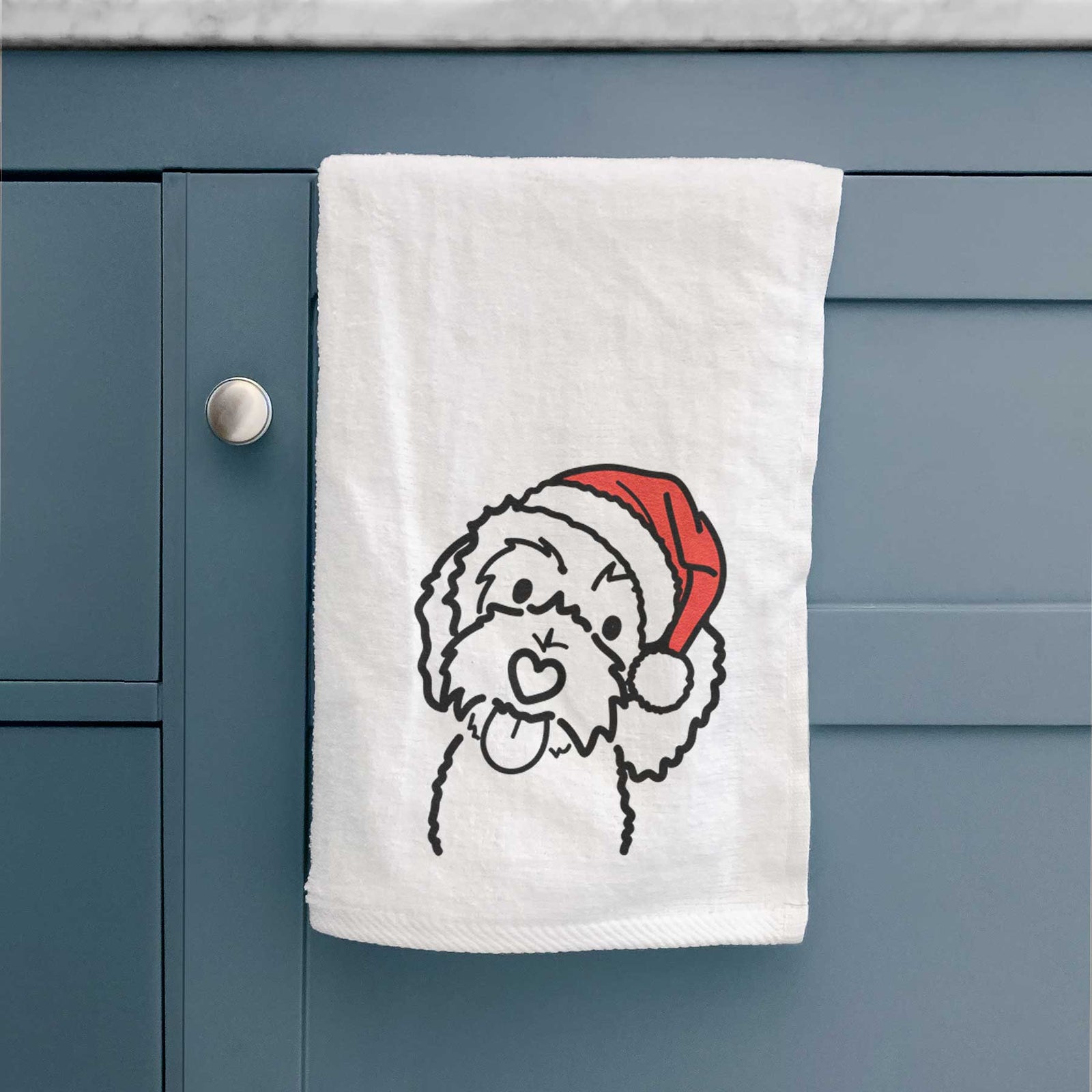 Minimalist line drawing of Mabel the Bernedoodle wearing a Santa hat on a decorative hand towel