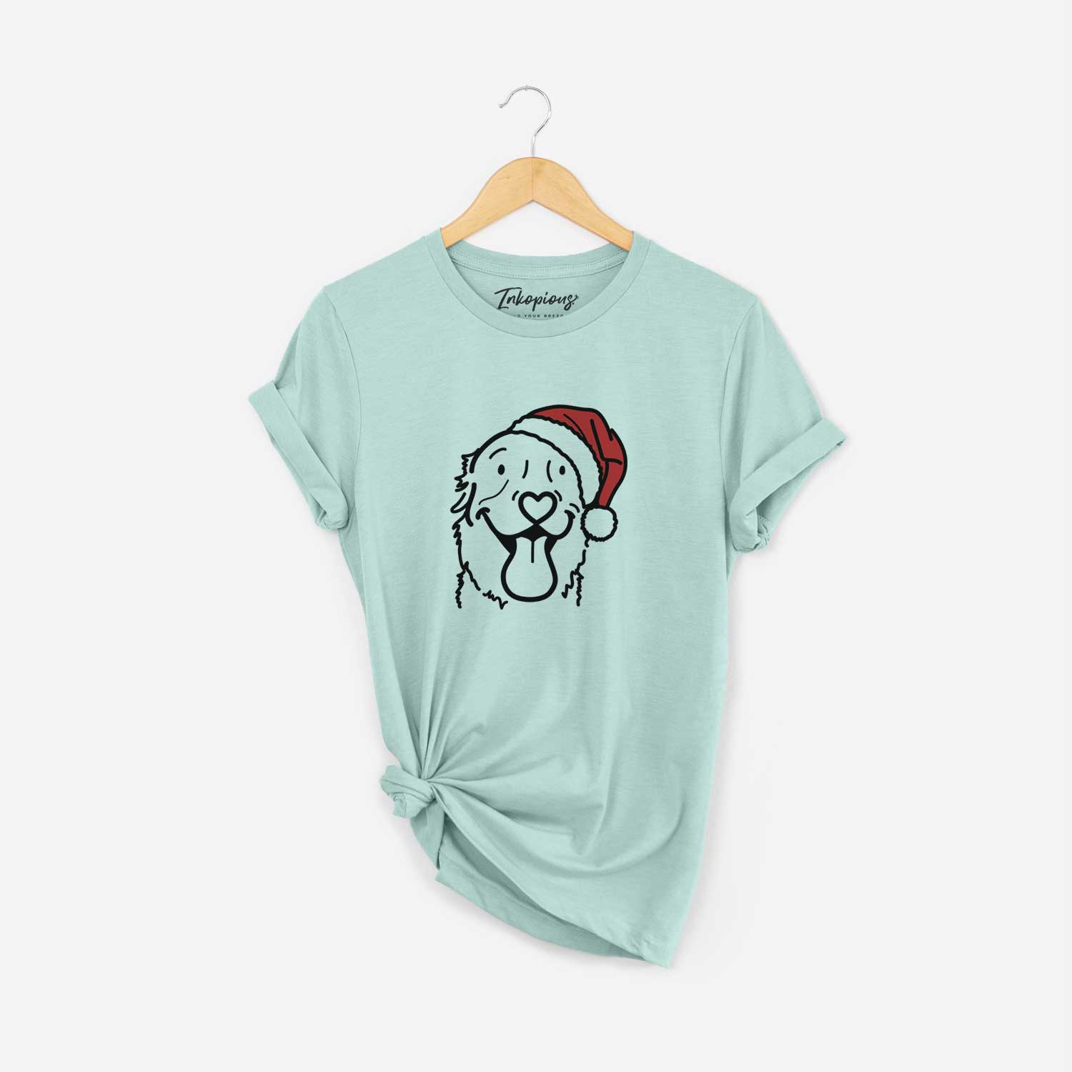 Minimalist line drawing of Maple the Golden Retriever wearing a Santa hat on a Heather Sage Unisex crewneck