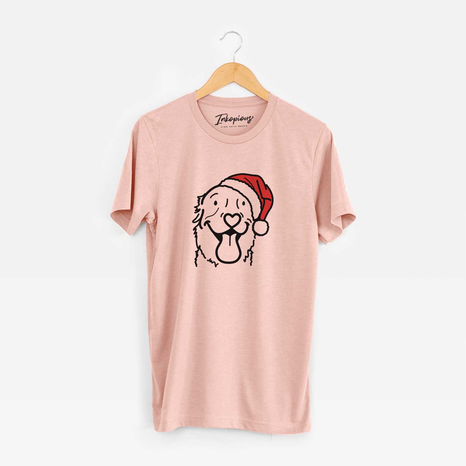 Minimalist line drawing of Maple the Golden Retriever wearing a Santa hat on a Peach Unisex crewneck
