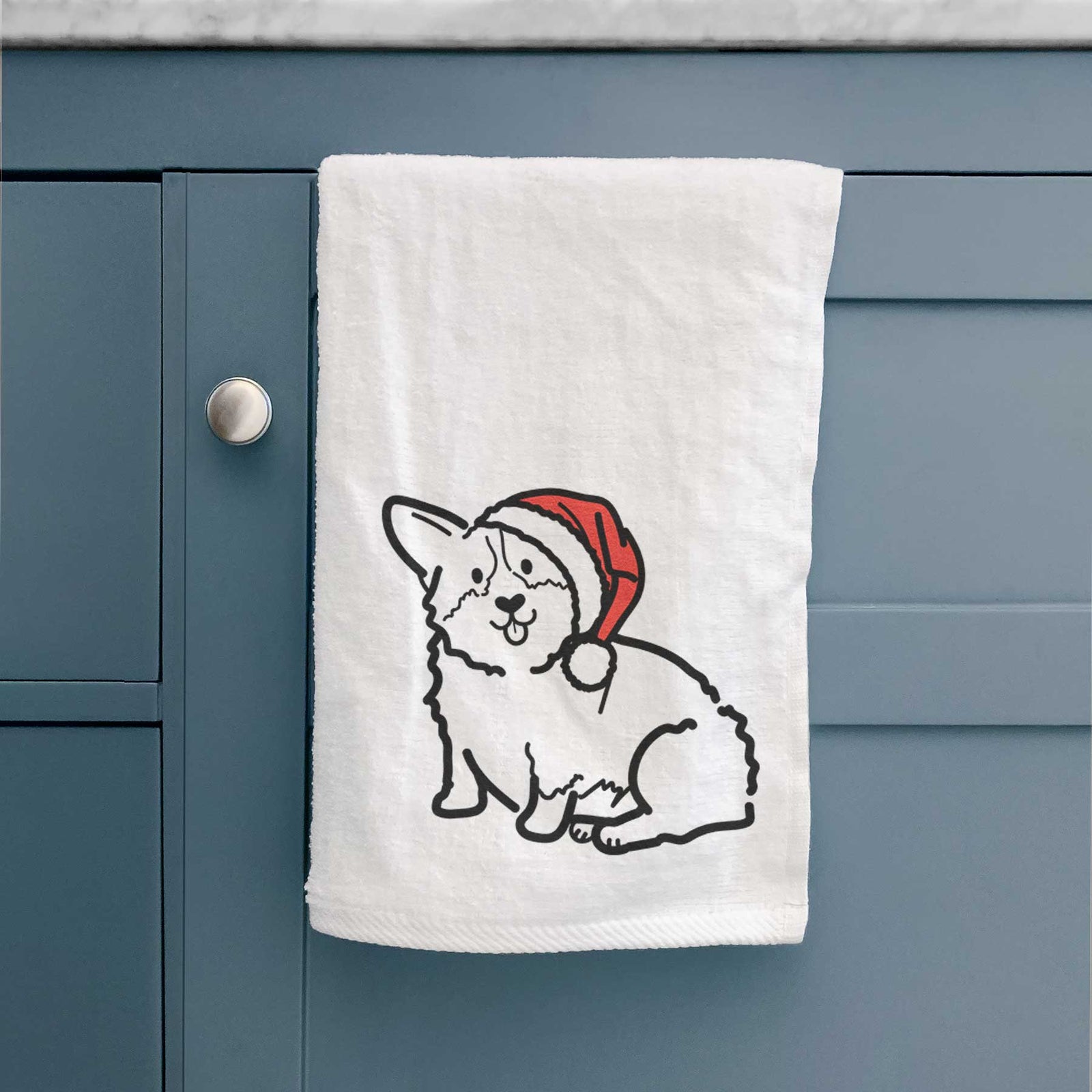 Minimalist line drawing of Millie the Pembroke Welsh Corgi wearing a Santa hat on a decorative hand towel
