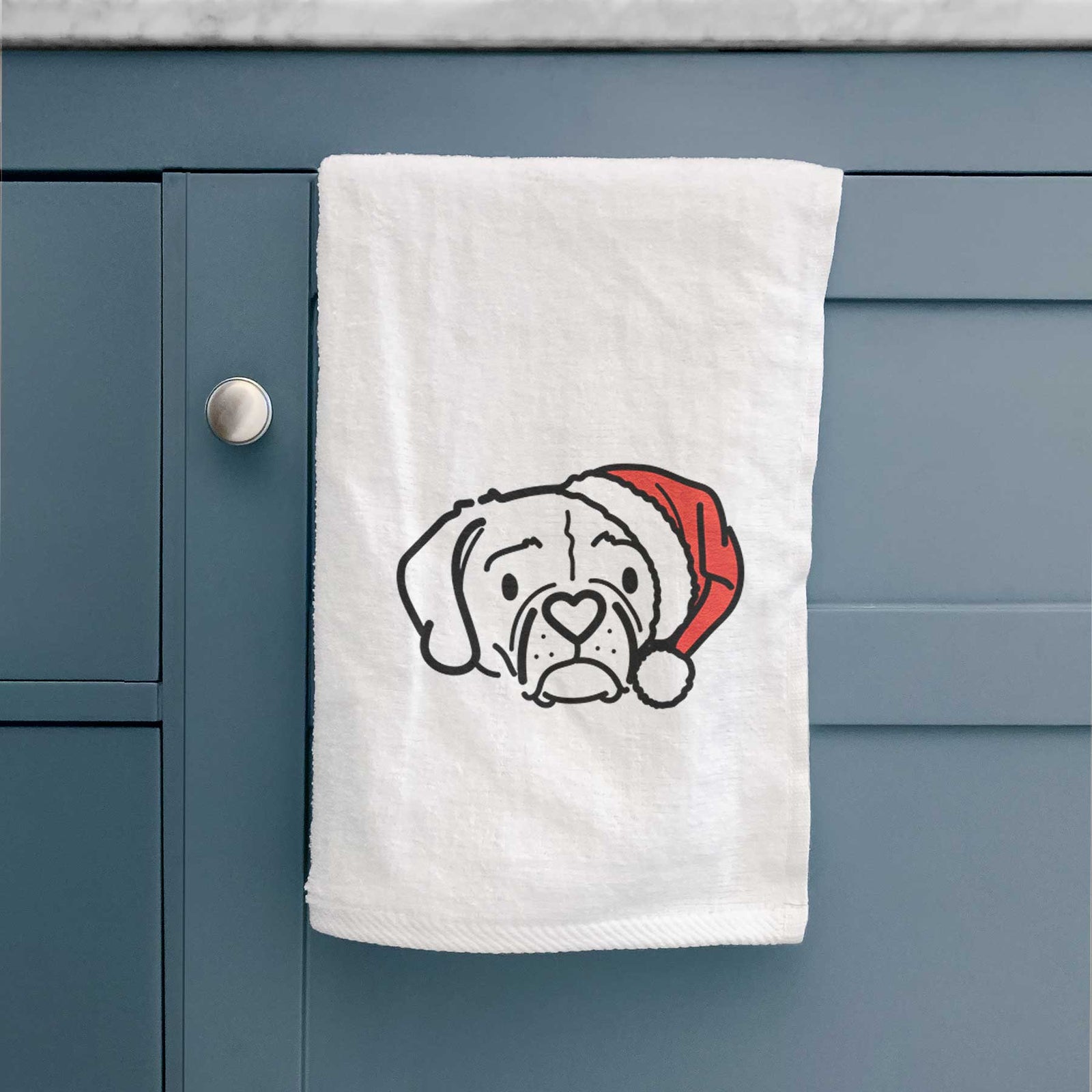 Minimalist line drawing of Mitzi the Puggle wearing a Santa hat on a decorative hand towel