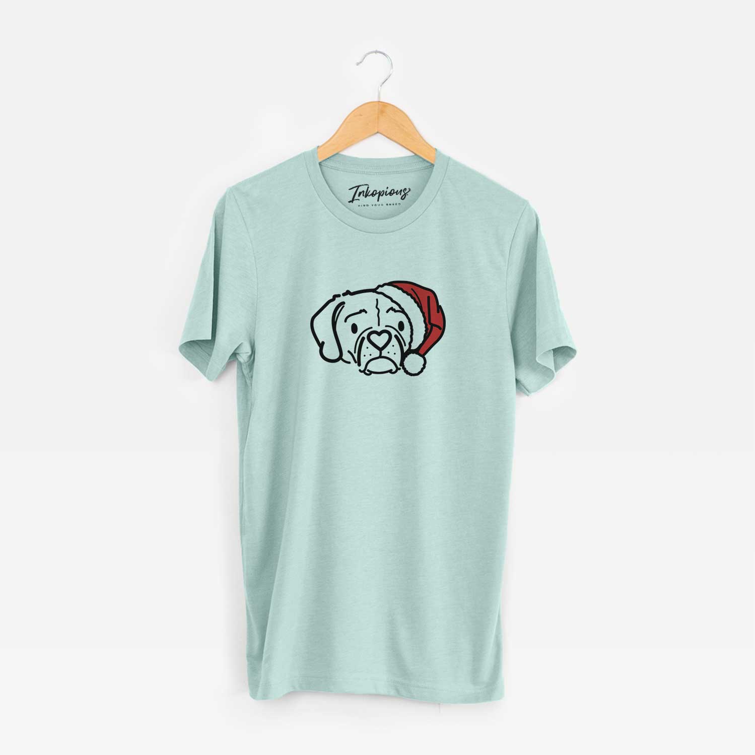 Minimalist line drawing of Mitzi the Puggle wearing a Santa hat on a Heather Sage Unisex crewneck