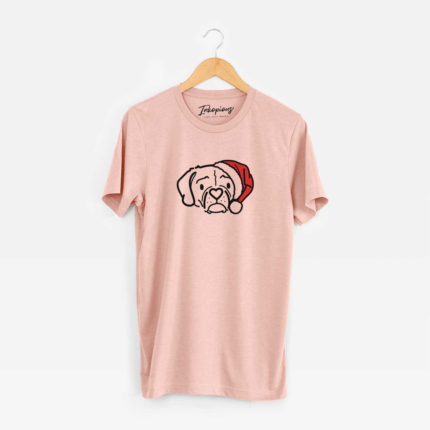 Minimalist line drawing of Mitzi the Puggle wearing a Santa hat on a Peach Unisex crewneck