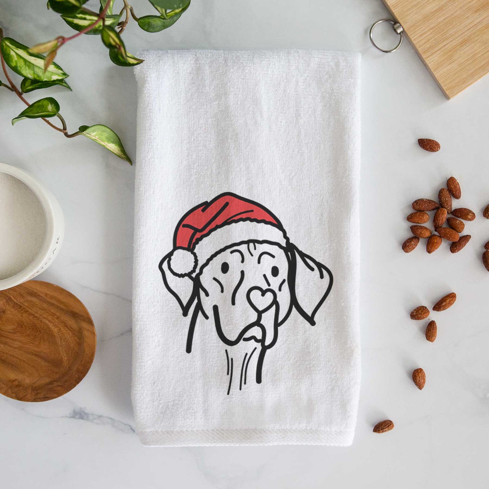 Minimalist line drawing of Moose the Vizsla wearing a Santa hat on a decorative hand towel