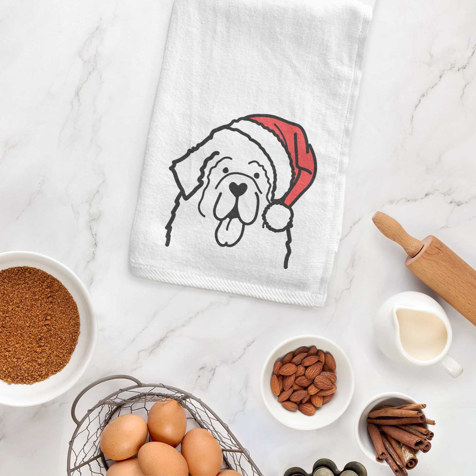 Minimalist line drawing of a Newfoundland wearing a Santa hat on a decorative hand towel