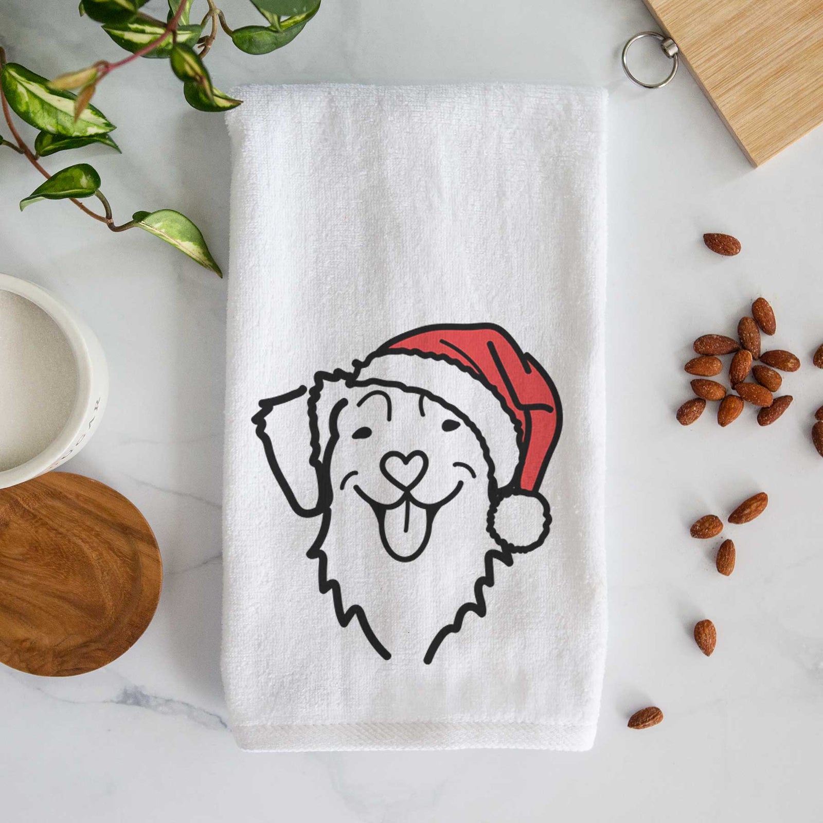 Minimalist line drawing of a Nova Scotia Duck Tolling Retriever wearing a Santa hat on a decorative hand towel