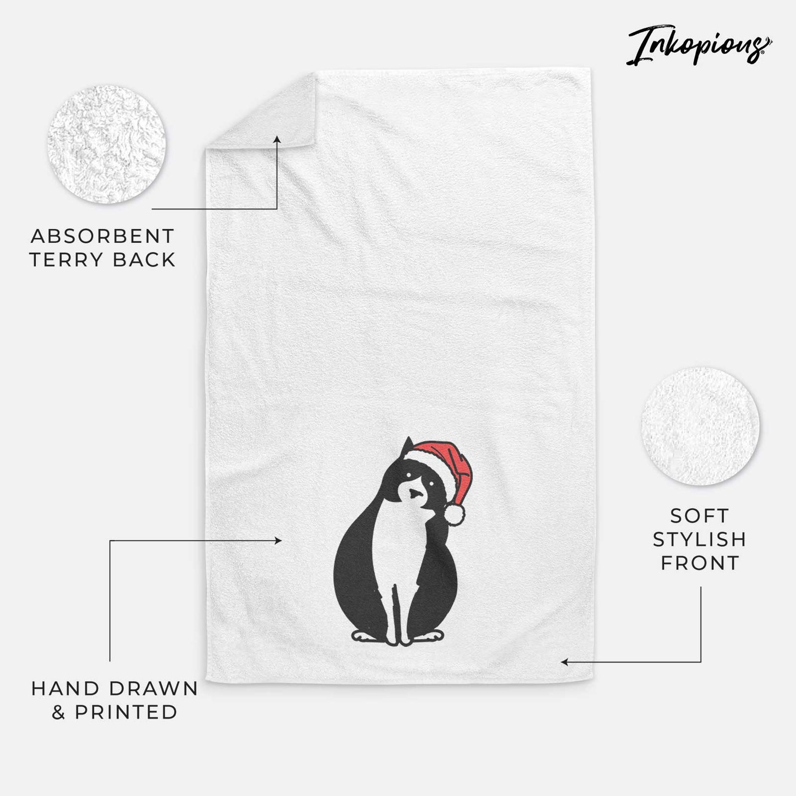 Minimalist line drawing of Oliver the Tuxedo Cat wearing a Santa hat on a decorative hand towel