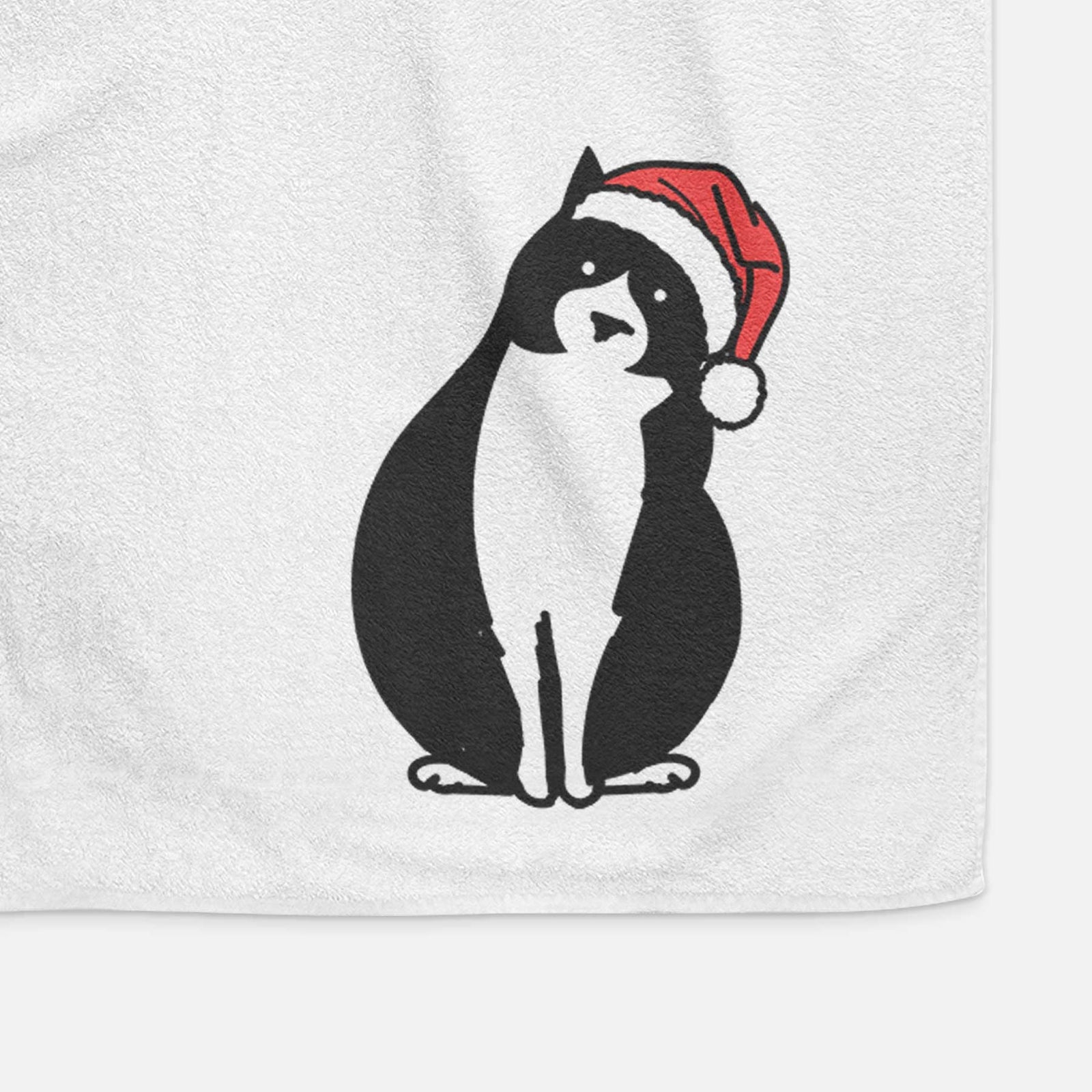 Minimalist line drawing of Oliver the Tuxedo Cat wearing a Santa hat on a decorative hand towel