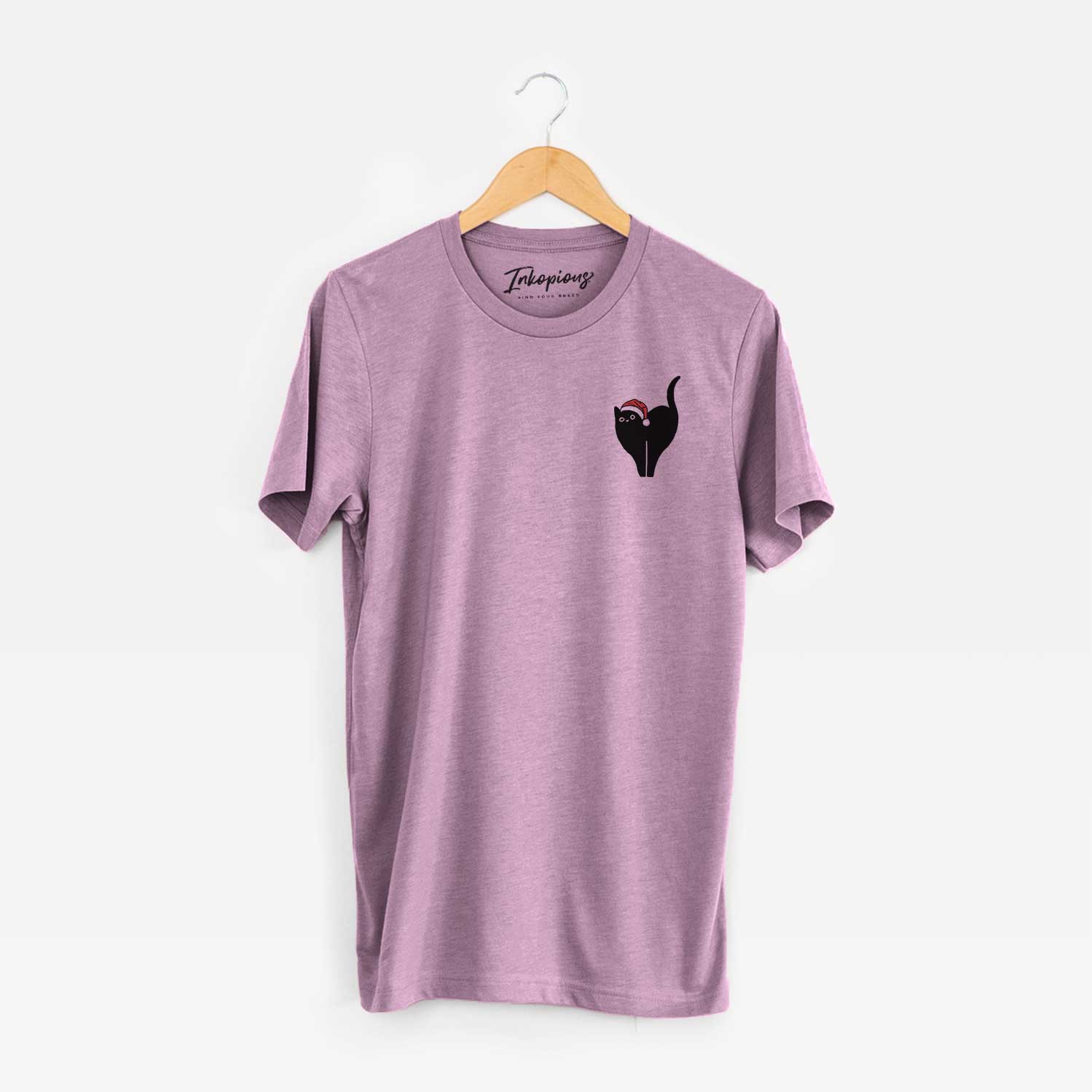 Small chest-pocket minimalist line drawing of Bella the Black Cat wearing a Santa hat on an Orchid Unisex crewneck