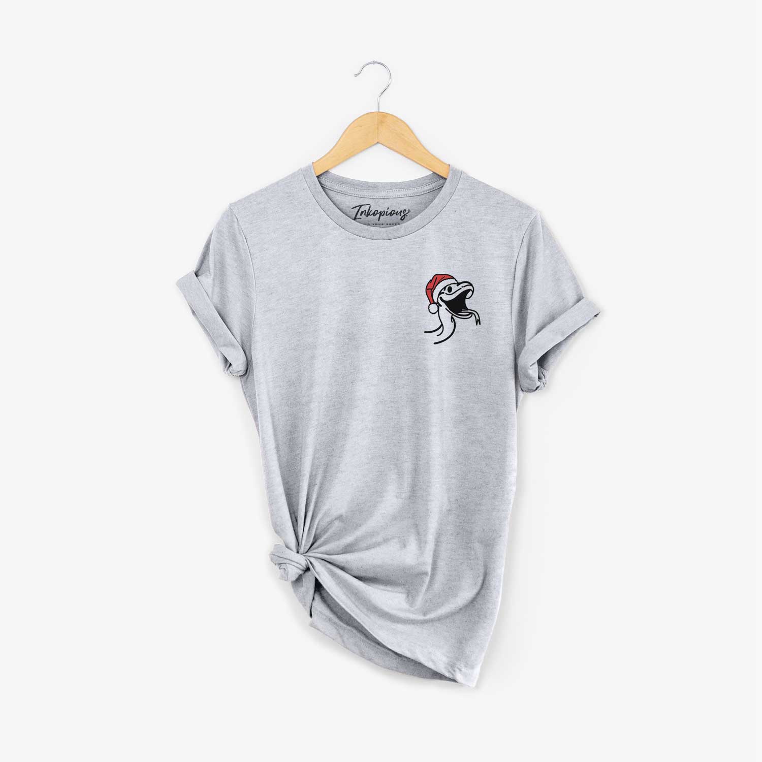 Small chest-pocket minimalist line drawing of Spike the Snake wearing a Santa hat on a Grey Unisex crewneck