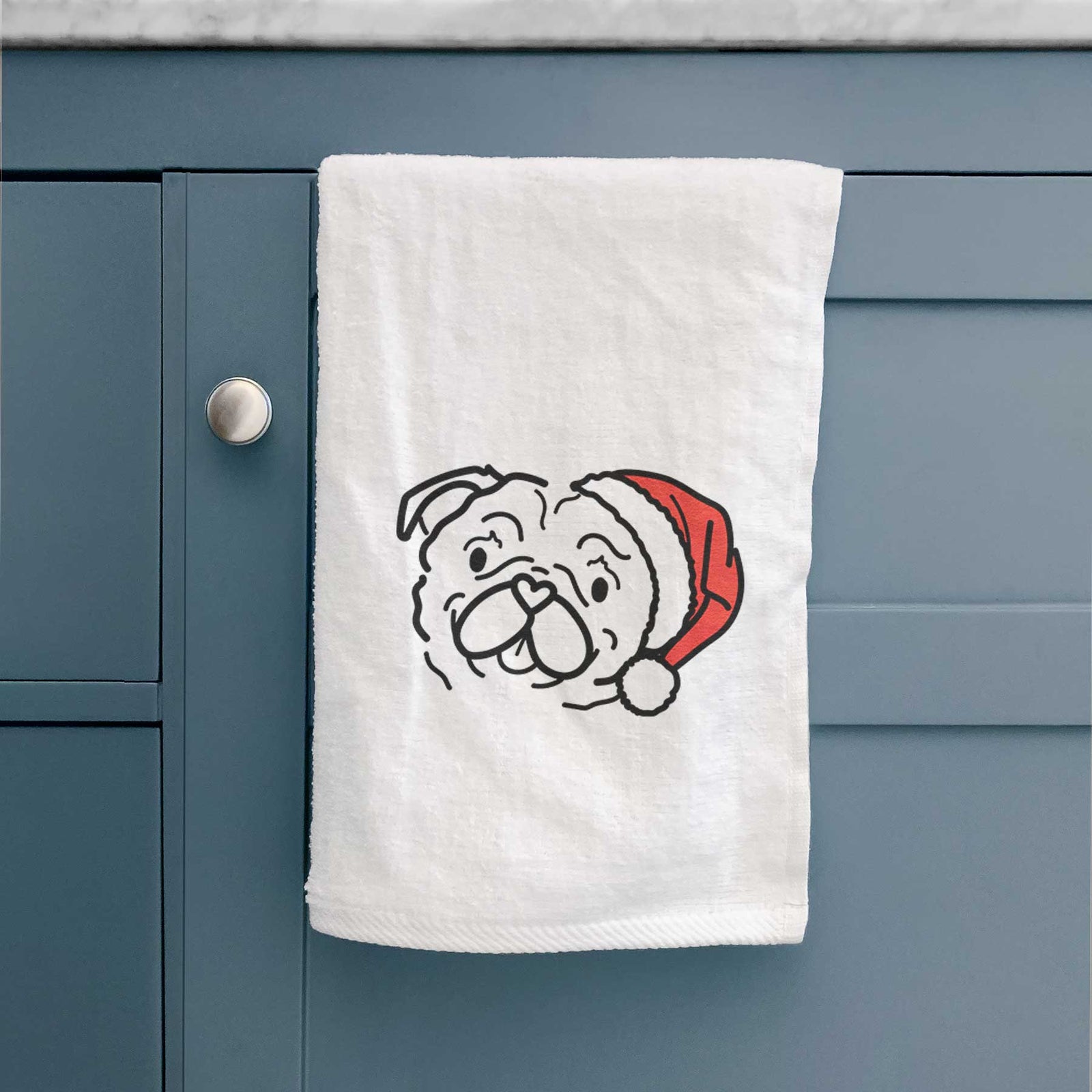 Minimalist line drawing of Pip the Pug wearing a Santa hat on a decorative hand towel