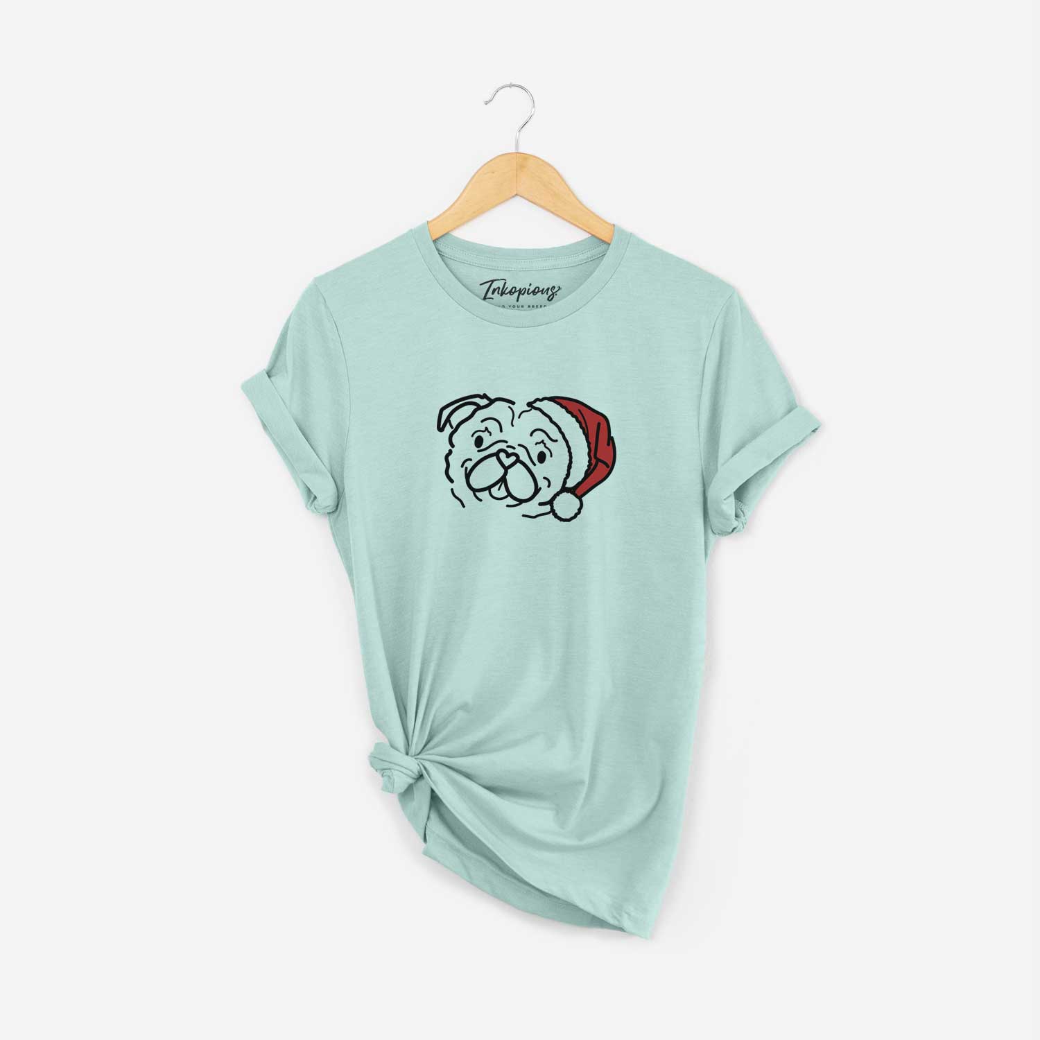 Minimalist line drawing of Pip the Pug wearing a Santa hat on a Heather Sage Unisex crewneck