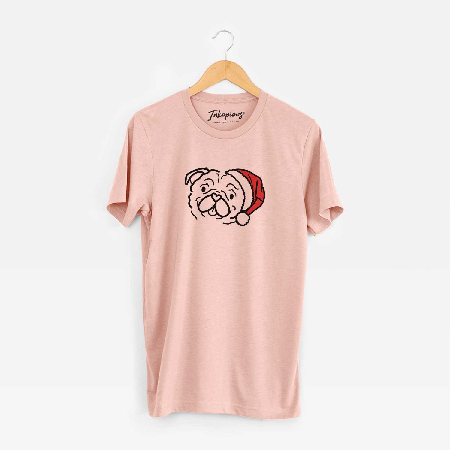 Minimalist line drawing of Pip the Pug wearing a Santa hat on a Peach Unisex crewneck
