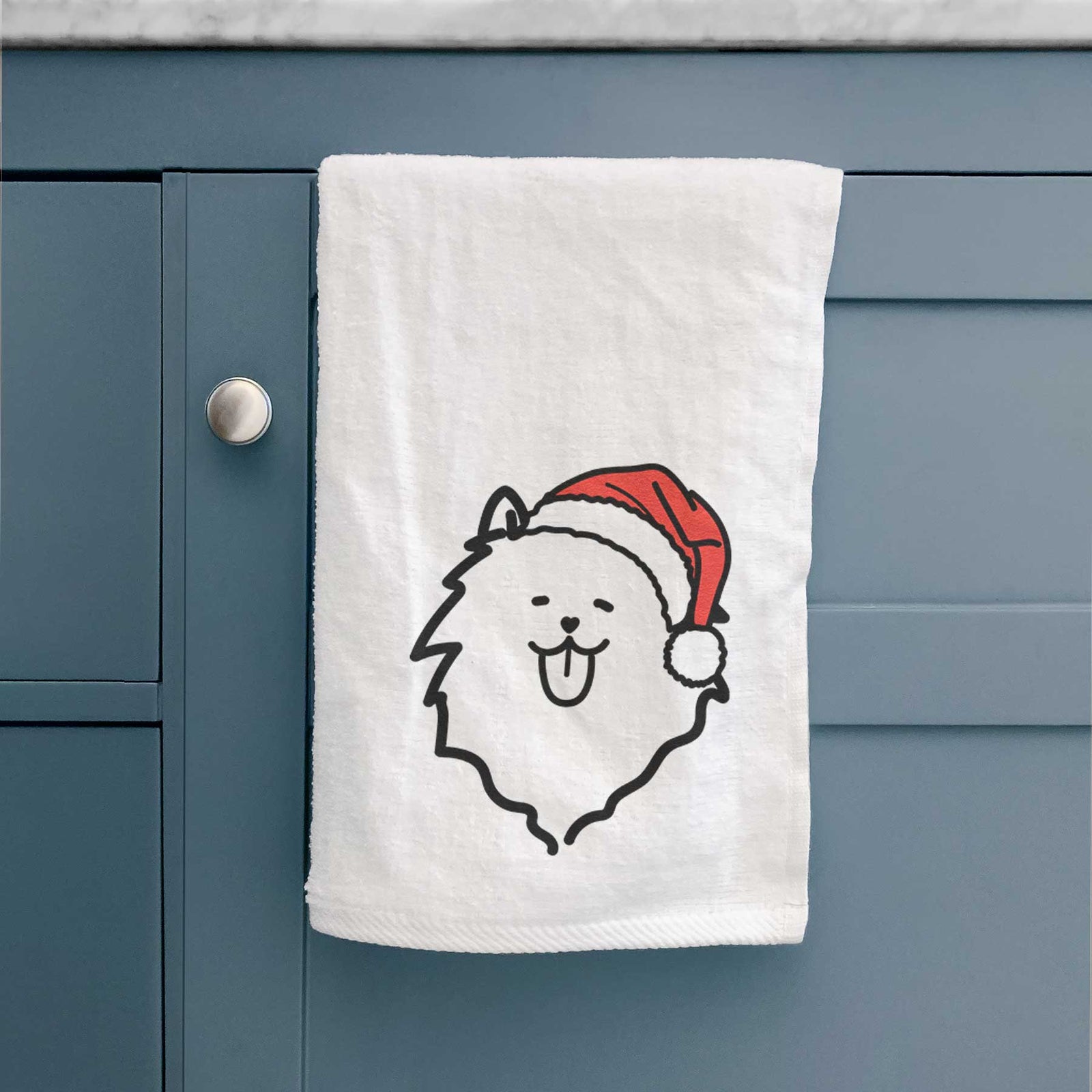 Minimalist line drawing of a Pomeranian wearing a Santa hat on a decorative hand towel