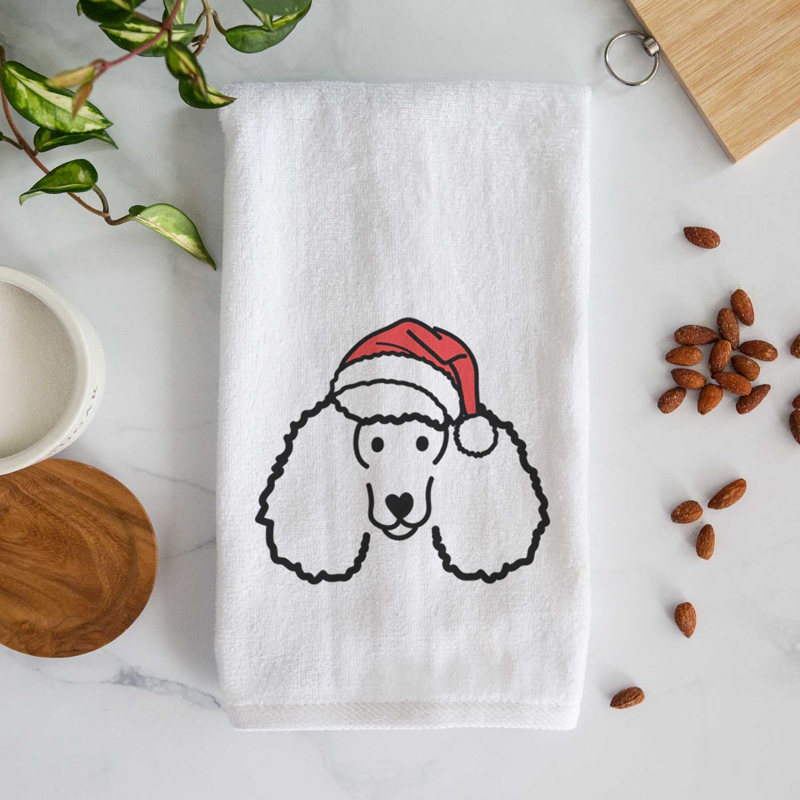 Minimalist line drawing of a Poodle wearing a Santa hat on a decorative hand towel