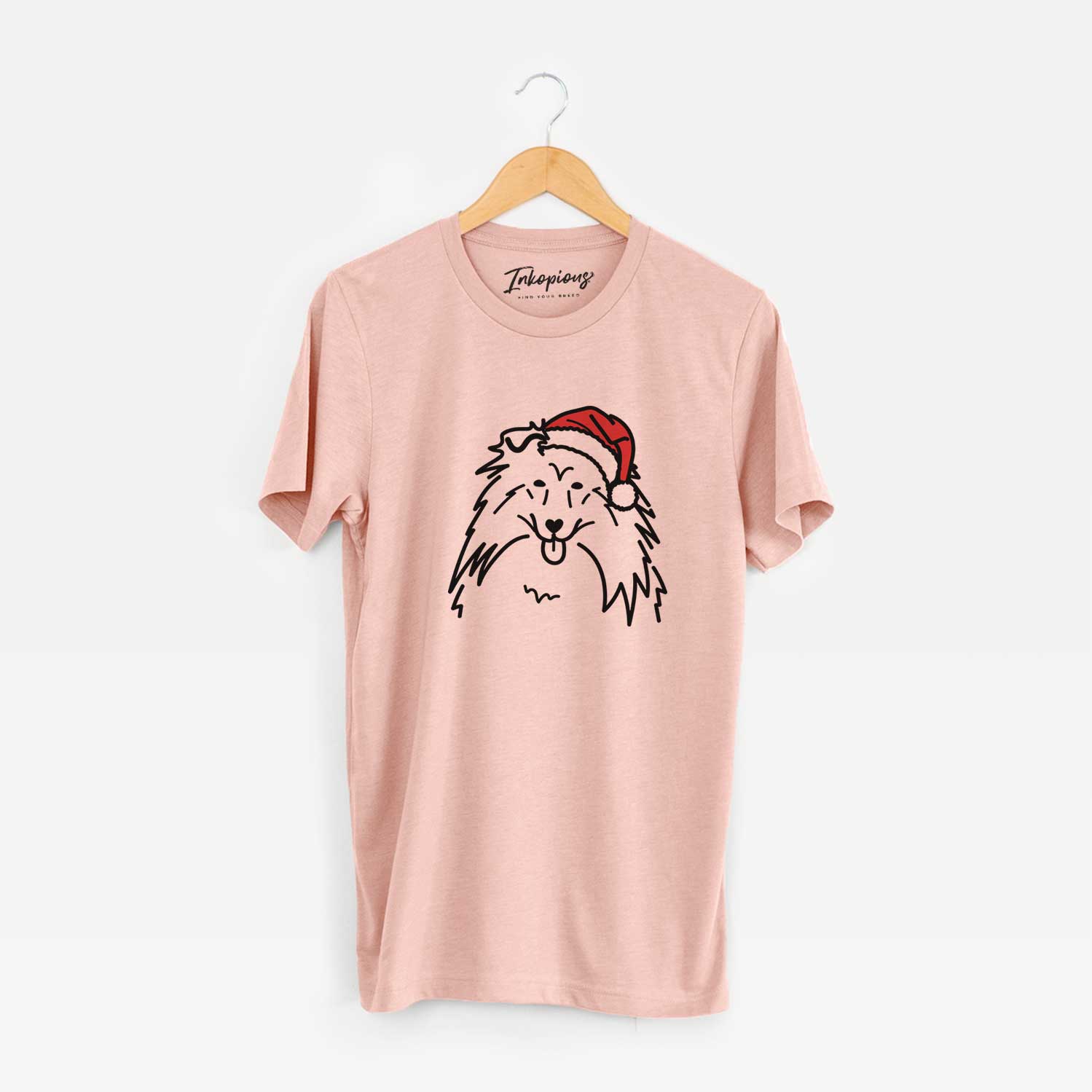 Minimalist line drawing of a Rough Collie wearing a Santa hat on a Peach Unisex crewneck