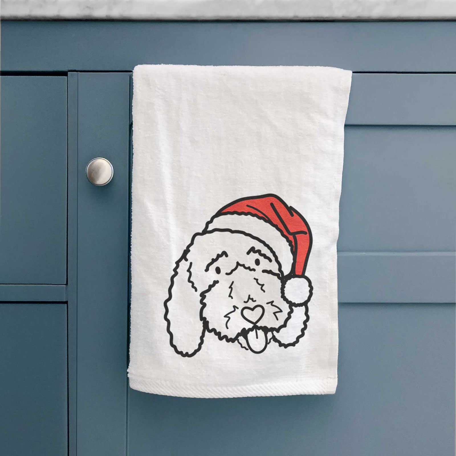 Minimalist line drawing of Ruby the Bernedoodle wearing a Santa hat on a decorative hand towel