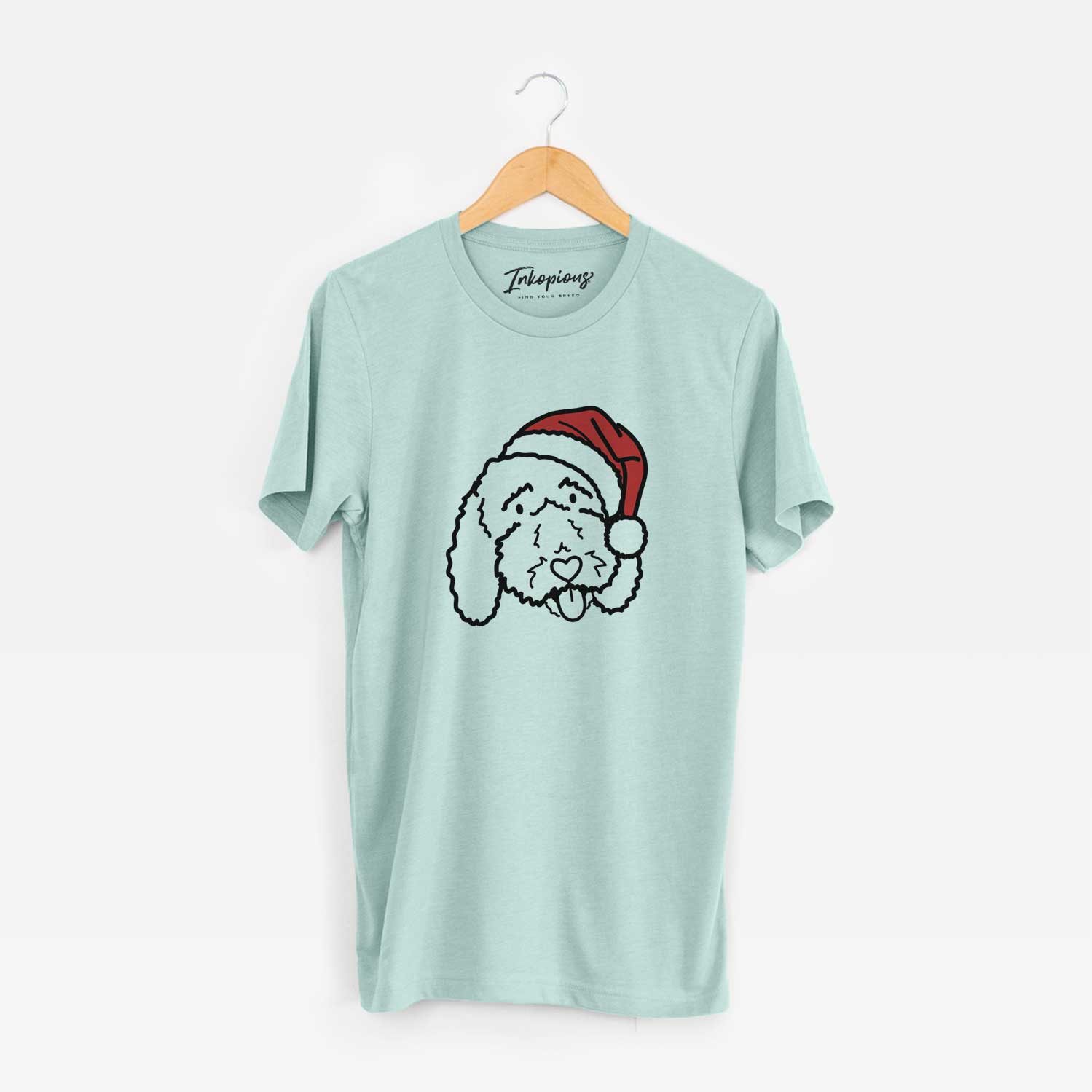 Minimalist line drawing of Ruby the Bernedoodle wearing a Santa hat on a Heather Sage Unisex crewneck