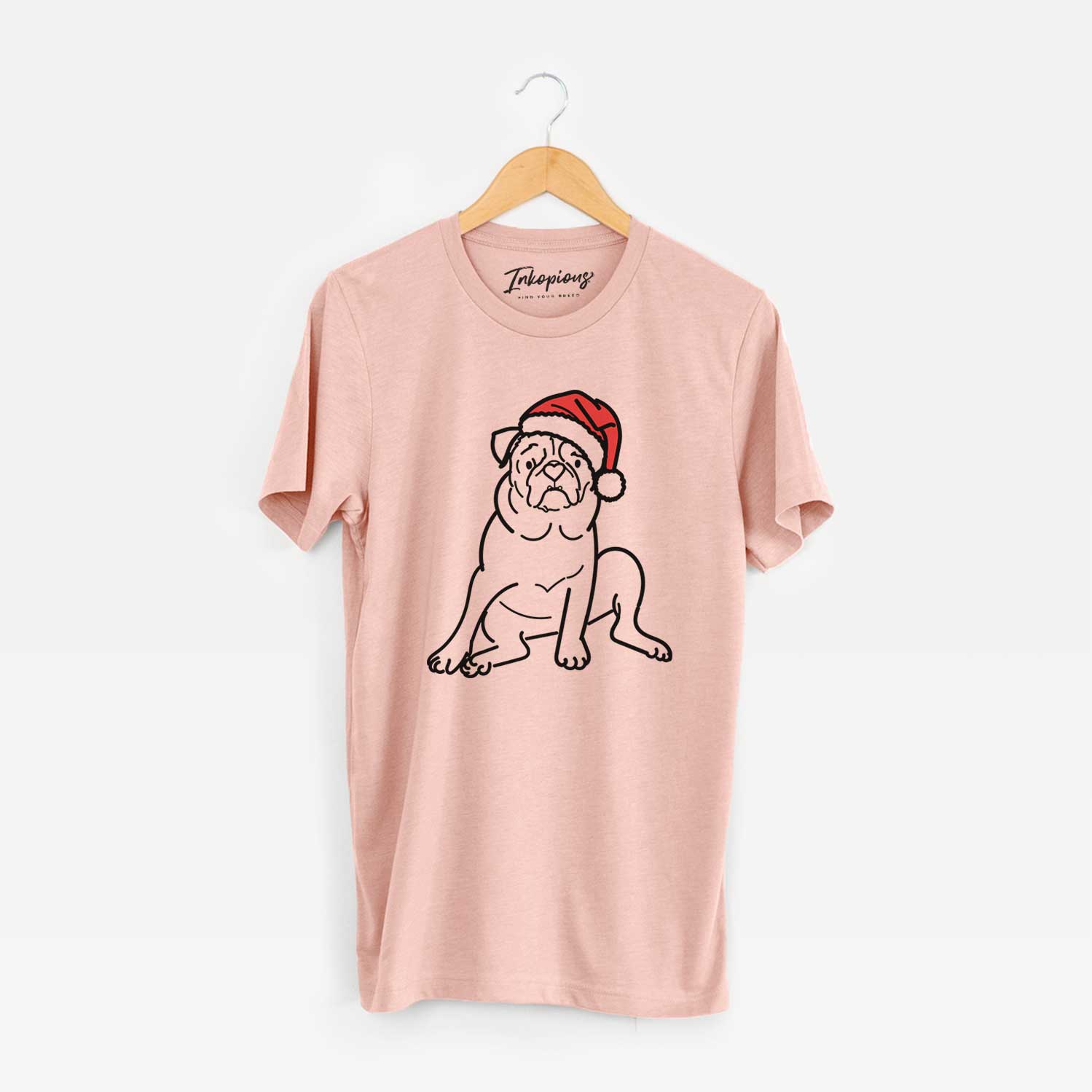 Minimalist line drawing of Rudy the Pug wearing a Santa hat on a Peach Unisex crewneck