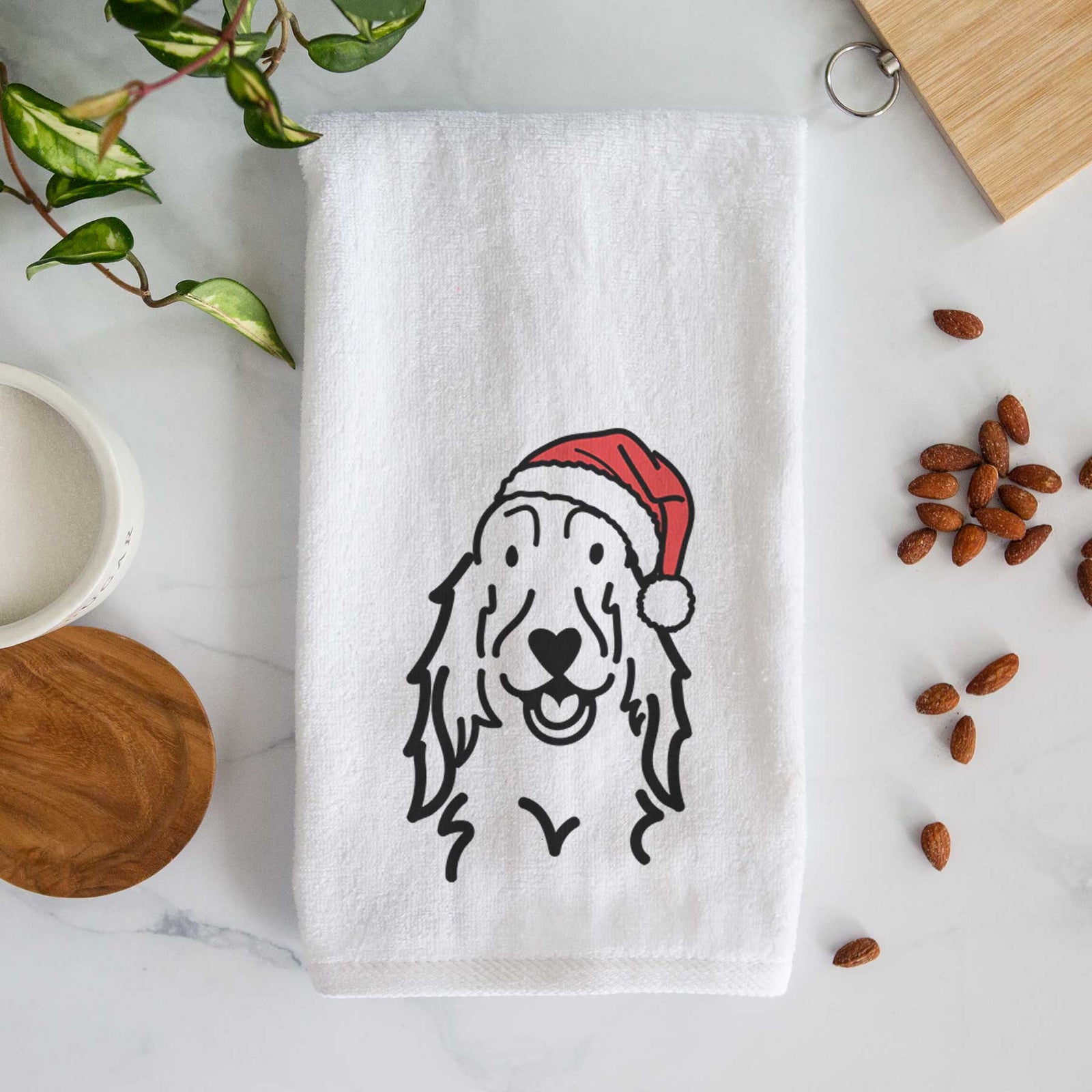 Minimalist line drawing of a Setter wearing a Santa hat on a decorative hand towel