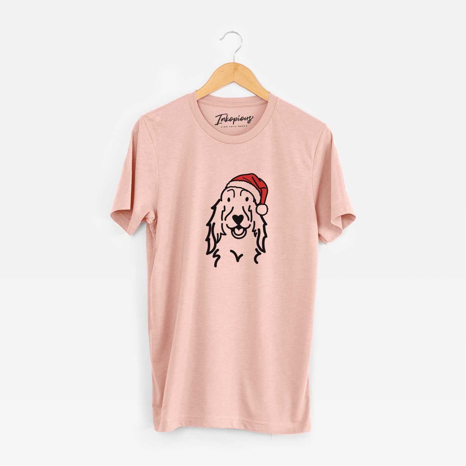 Minimalist line drawing of a Setter wearing a Santa hat on a Peach Unisex crewneck