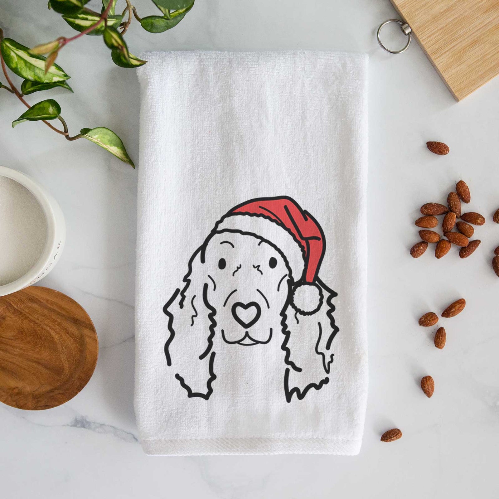 Minimalist line drawing of Seven the Irish Setter wearing a Santa hat on a decorative hand towel