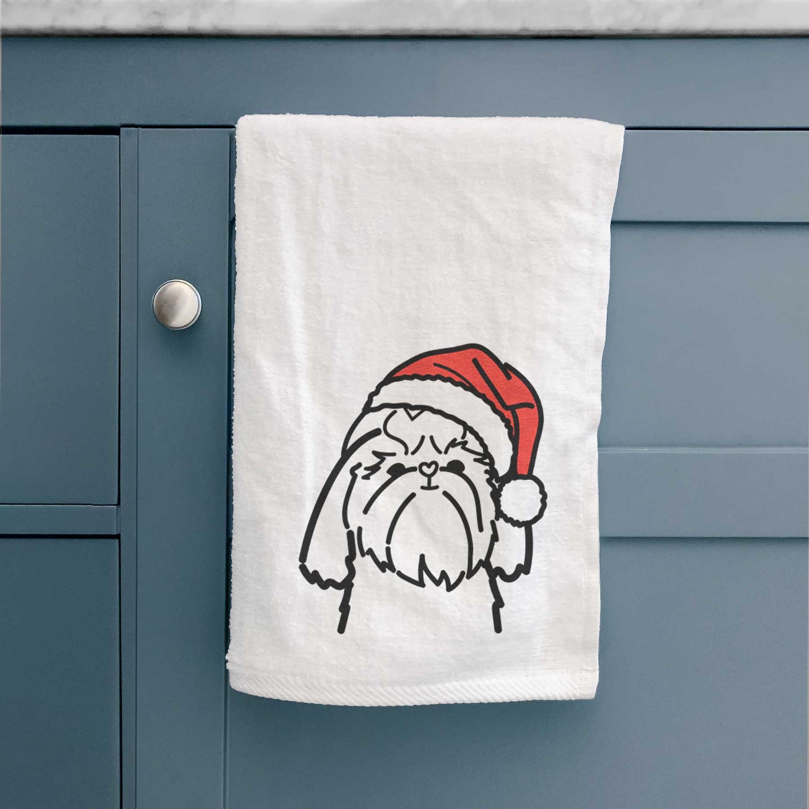 Minimalist line drawing of a Shih Tzu wearing a Santa hat on a decorative hand towel