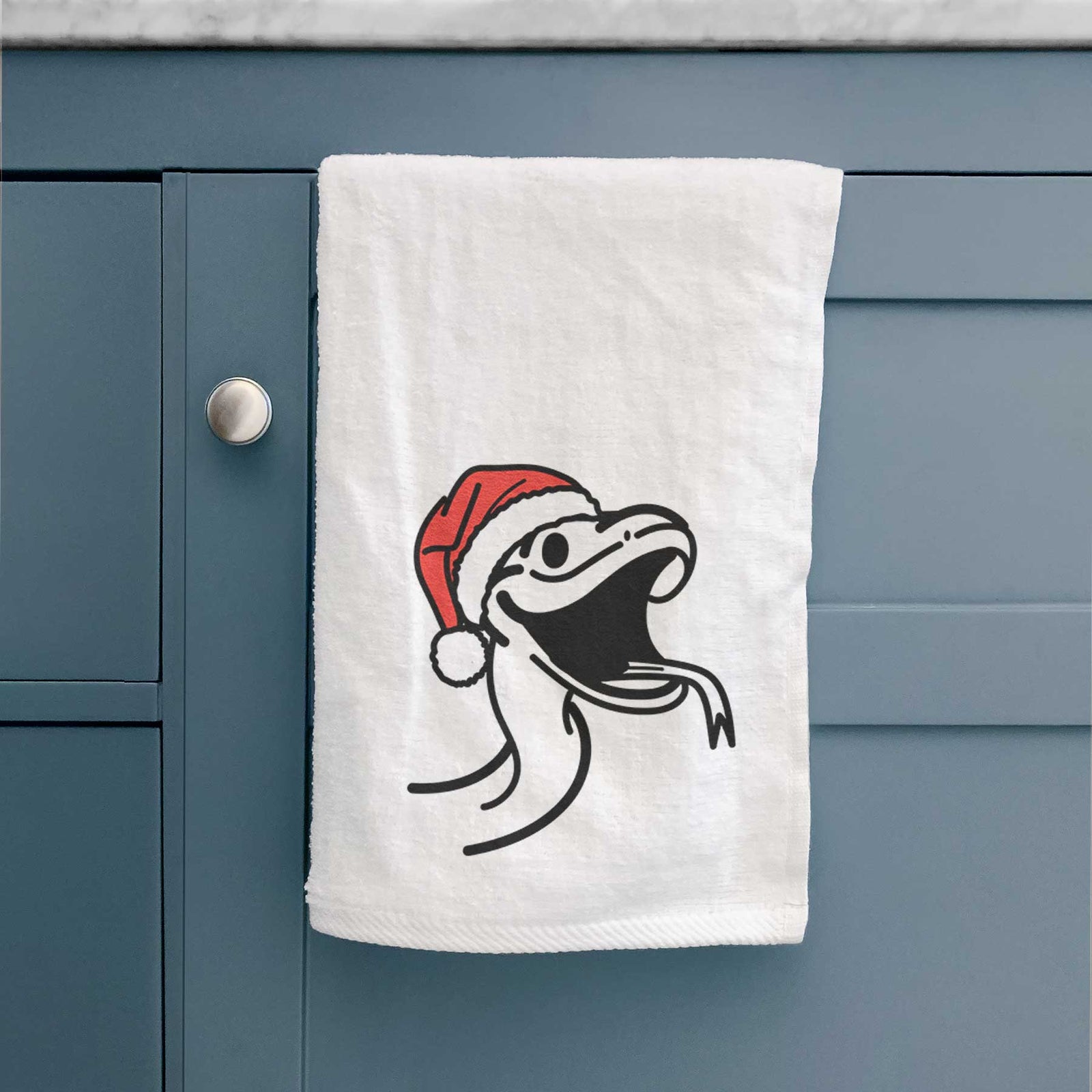 Minimalist line drawing of Spike the Snake wearing a Santa hat on a decorative hand towel