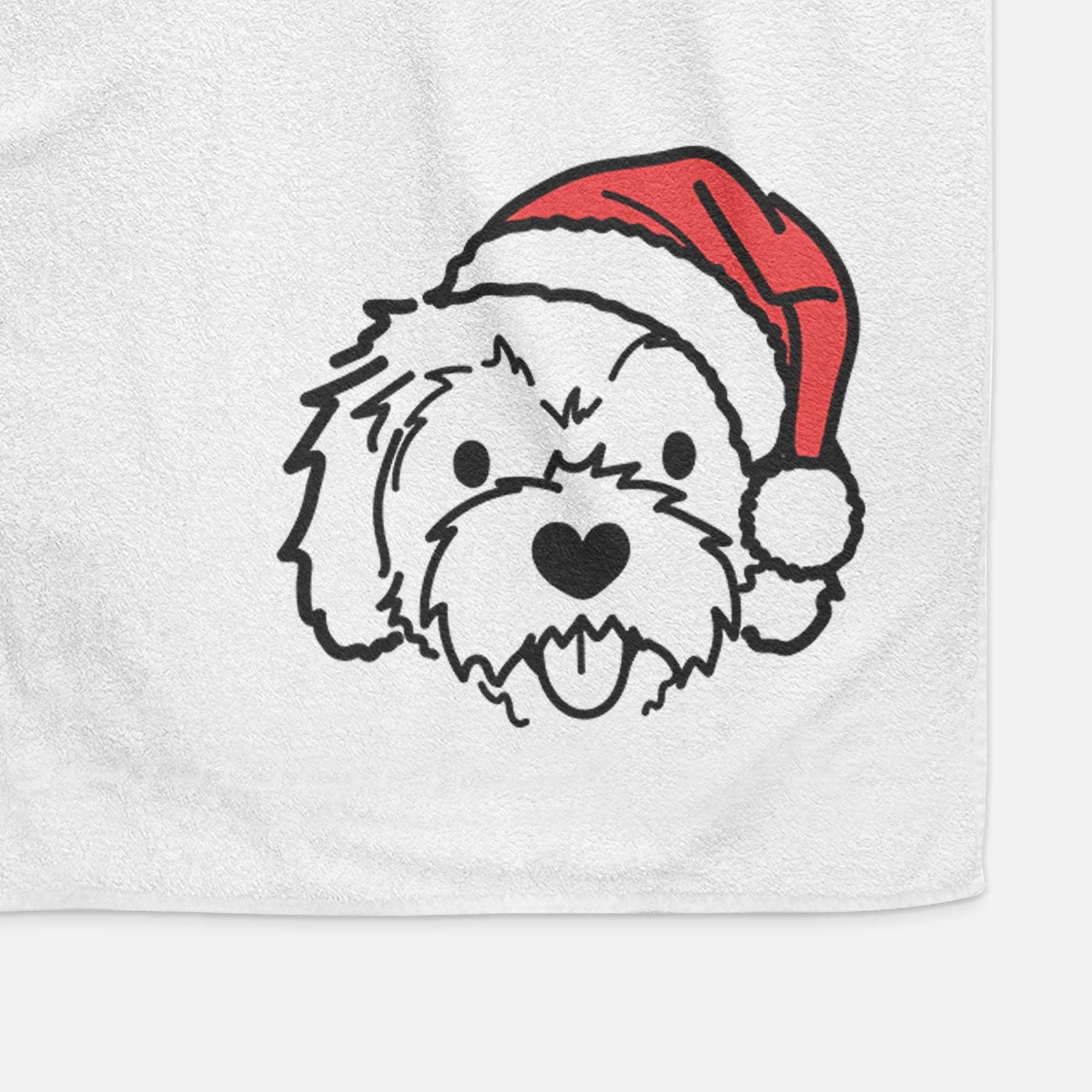 Minimalist line drawing of Sprinkles the Cockapoo wearing a Santa hat on a decorative hand towel