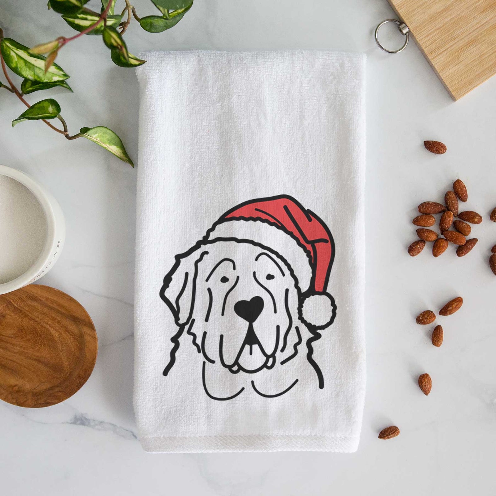 Minimalist line drawing of a Saint Bernard wearing a Santa hat on a decorative hand towel