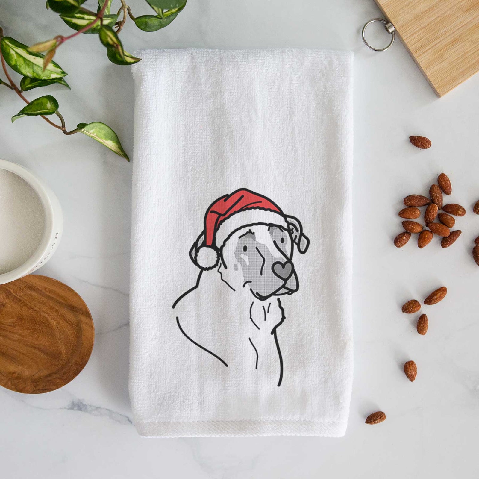 Minimalist line drawing of Tank the Mastiff German Shepherd Mix wearing a Santa hat on a decorative hand towel