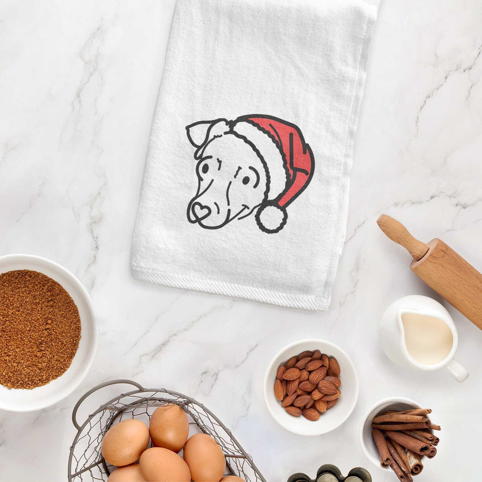 Minimalist line drawing of Tater Tot the Chiweenie wearing a Santa hat on a decorative hand towel