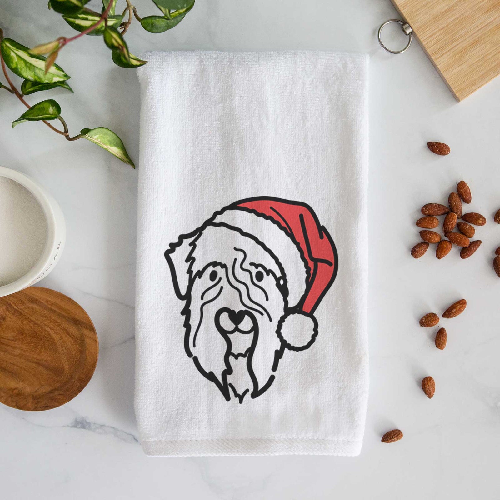 Minimalist line drawing of a Soft Coated Wheaten Terrier wearing a Santa hat on a decorative hand towel