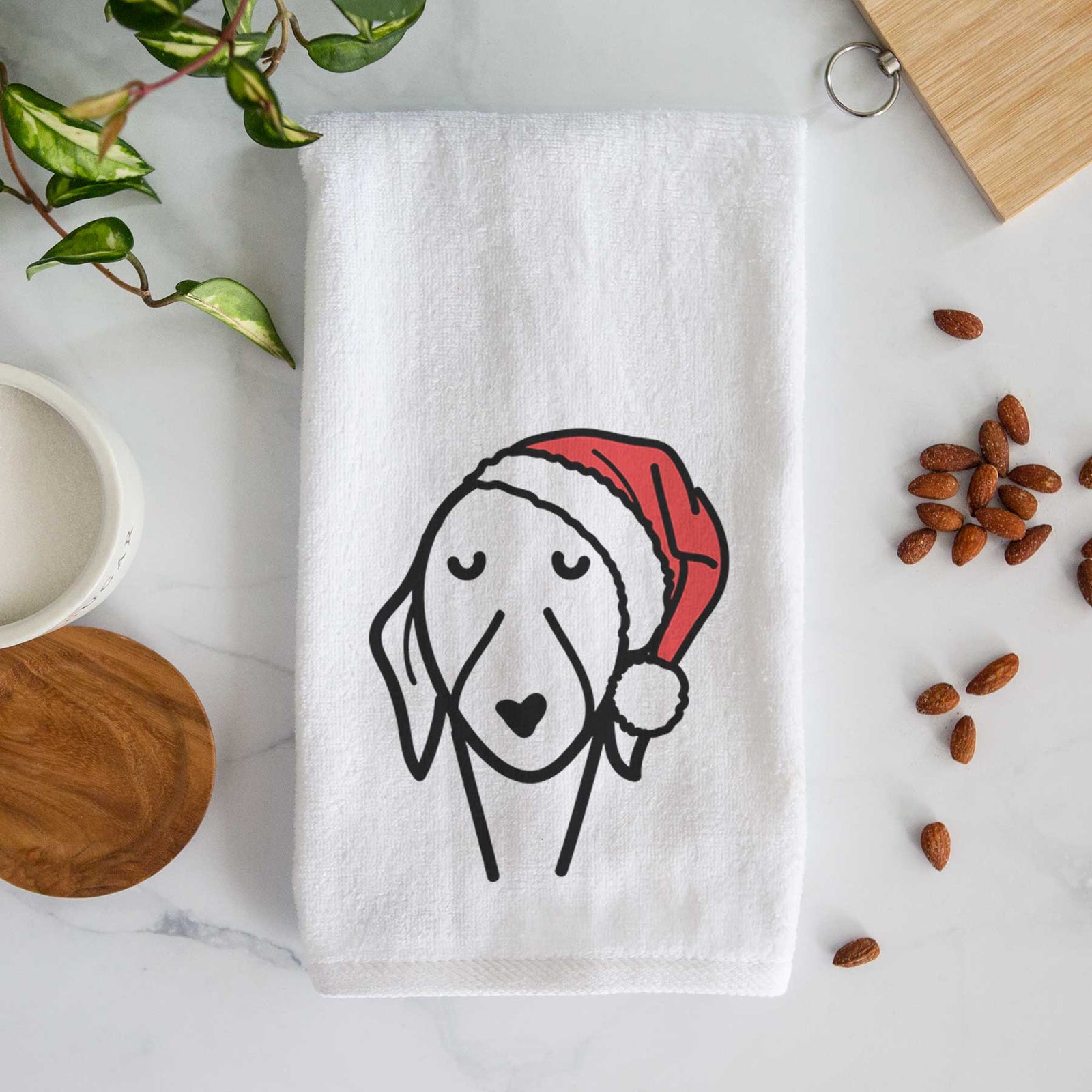 Minimalist line drawing of a Whippet wearing a Santa hat on a decorative hand towel