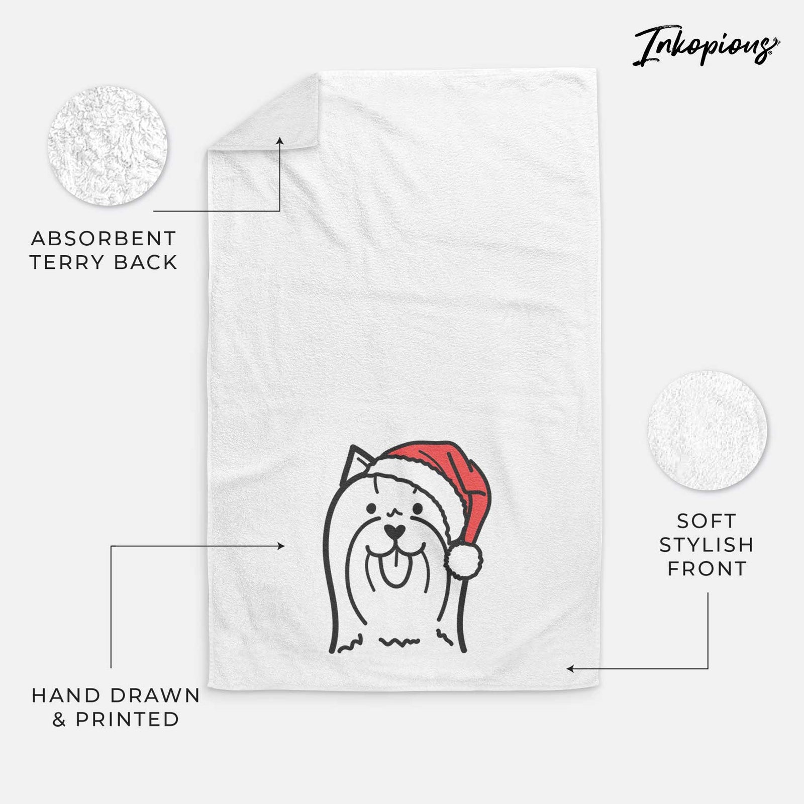 Minimalist line drawing of a Yorkshire Terrier wearing a Santa hat on a decorative hand towel
