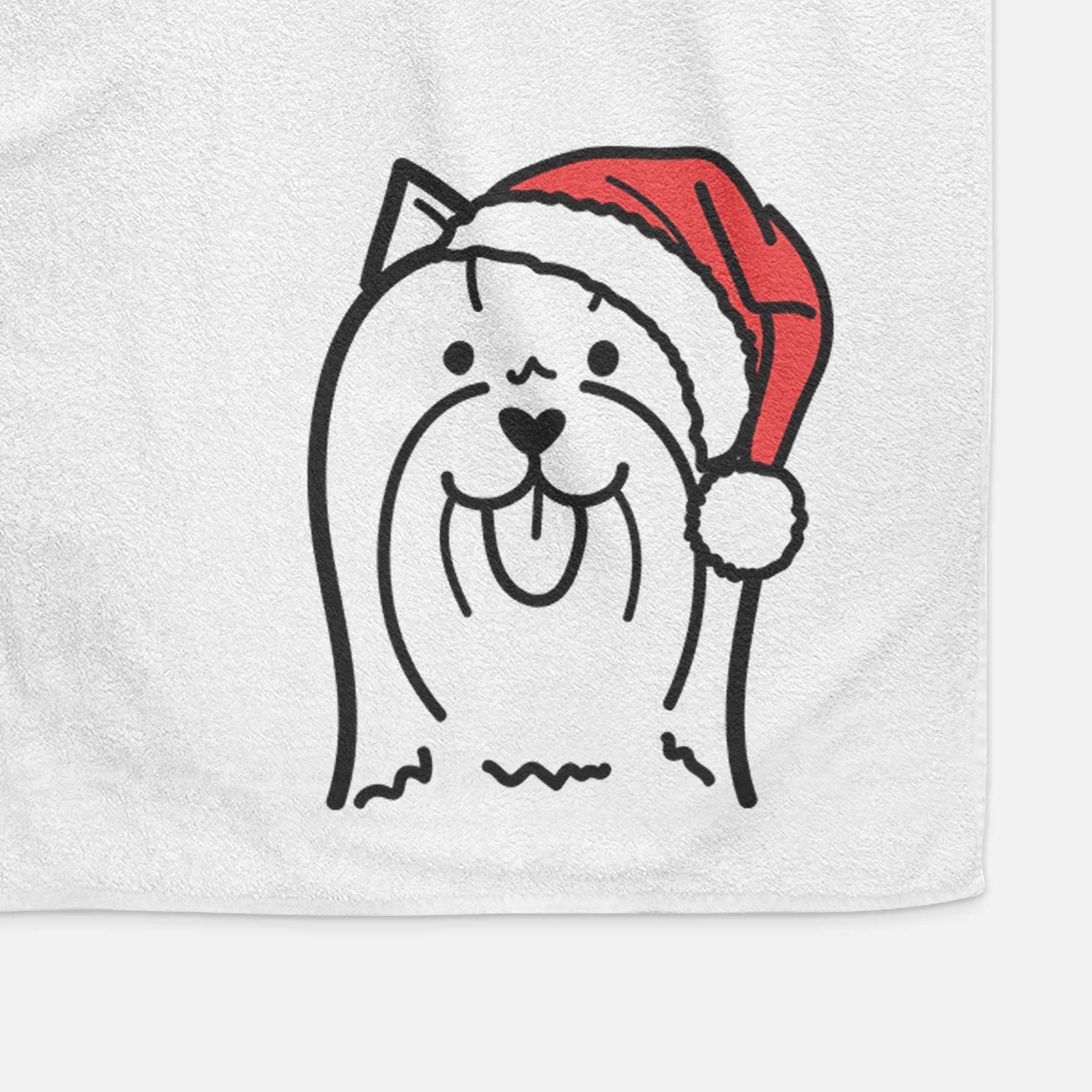 Minimalist line drawing of a Yorkshire Terrier wearing a Santa hat on a decorative hand towel