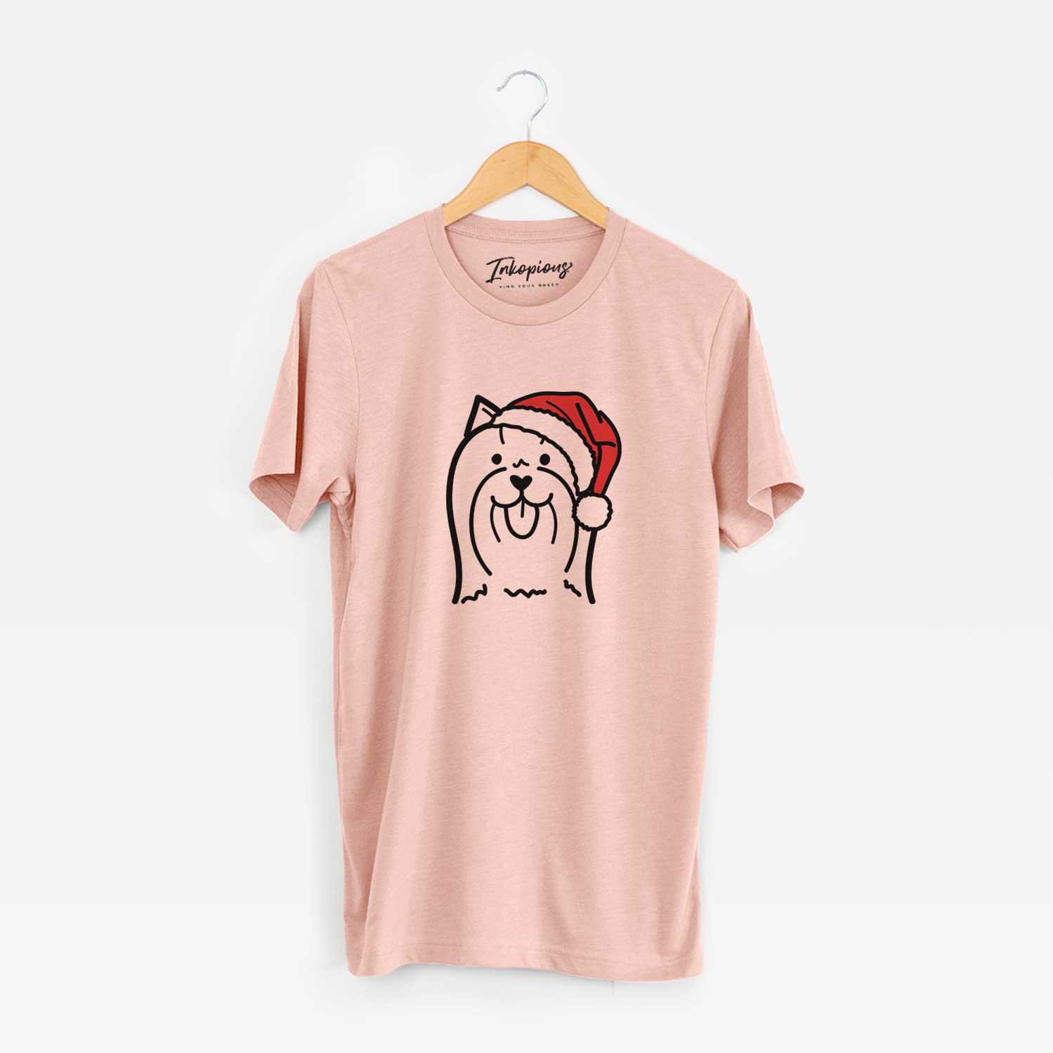 Minimalist line drawing of a Yorkshire Terrier wearing a Santa hat on a Peach Unisex crewneck