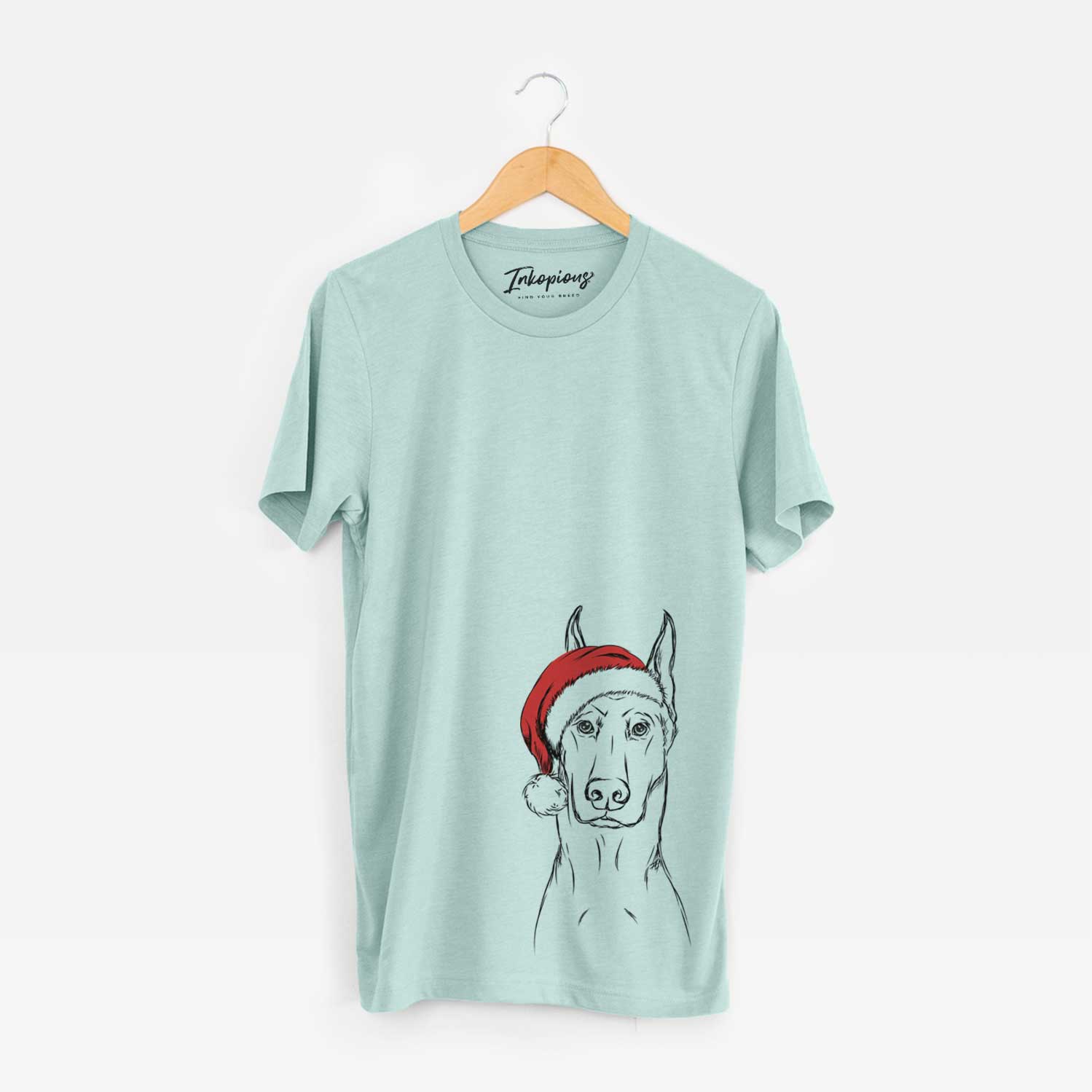 Hand-drawn sketch of Ace the Doberman Pinscher wearing a Santa hat on a Heather Sage Unisex crewneck
