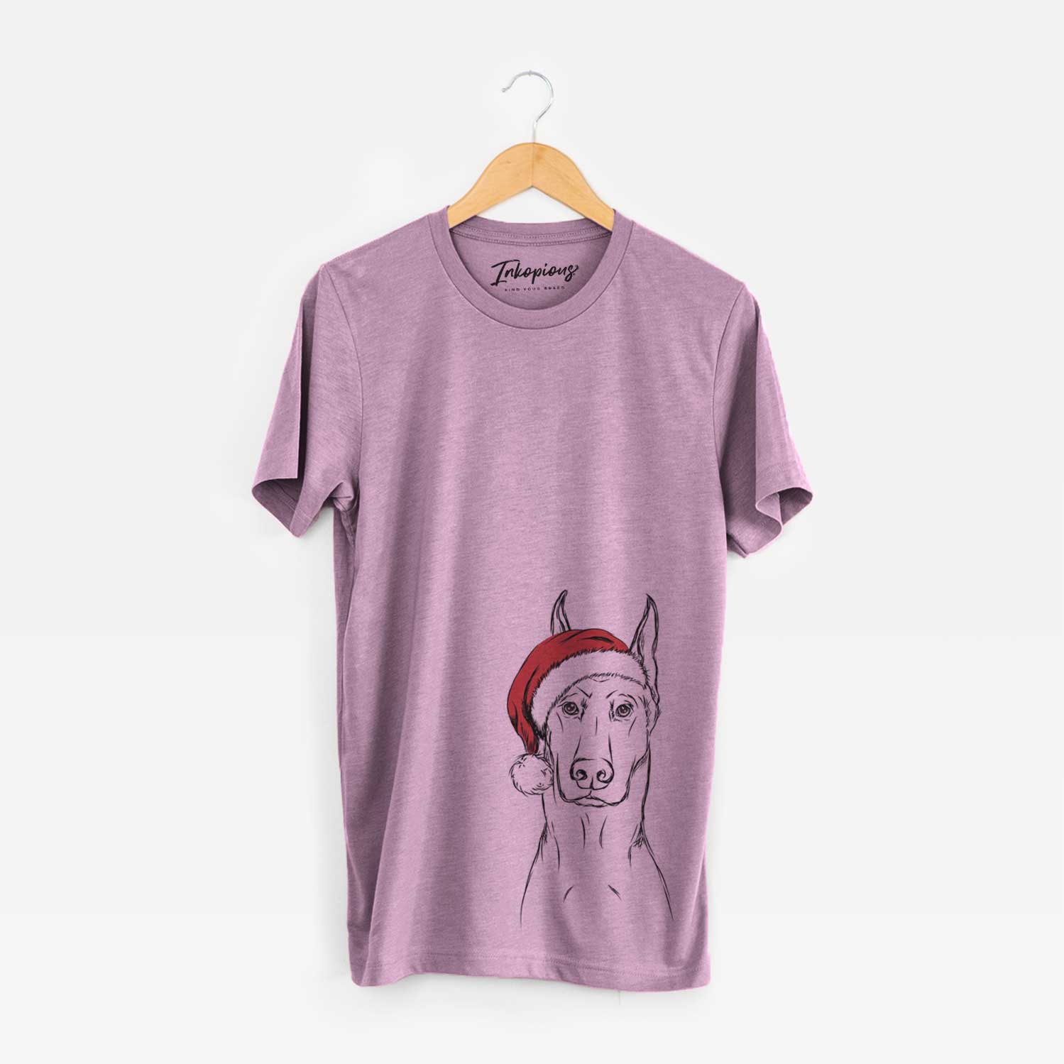 Hand-drawn sketch of Ace the Doberman Pinscher wearing a Santa hat on an Orchid Unisex crewneck