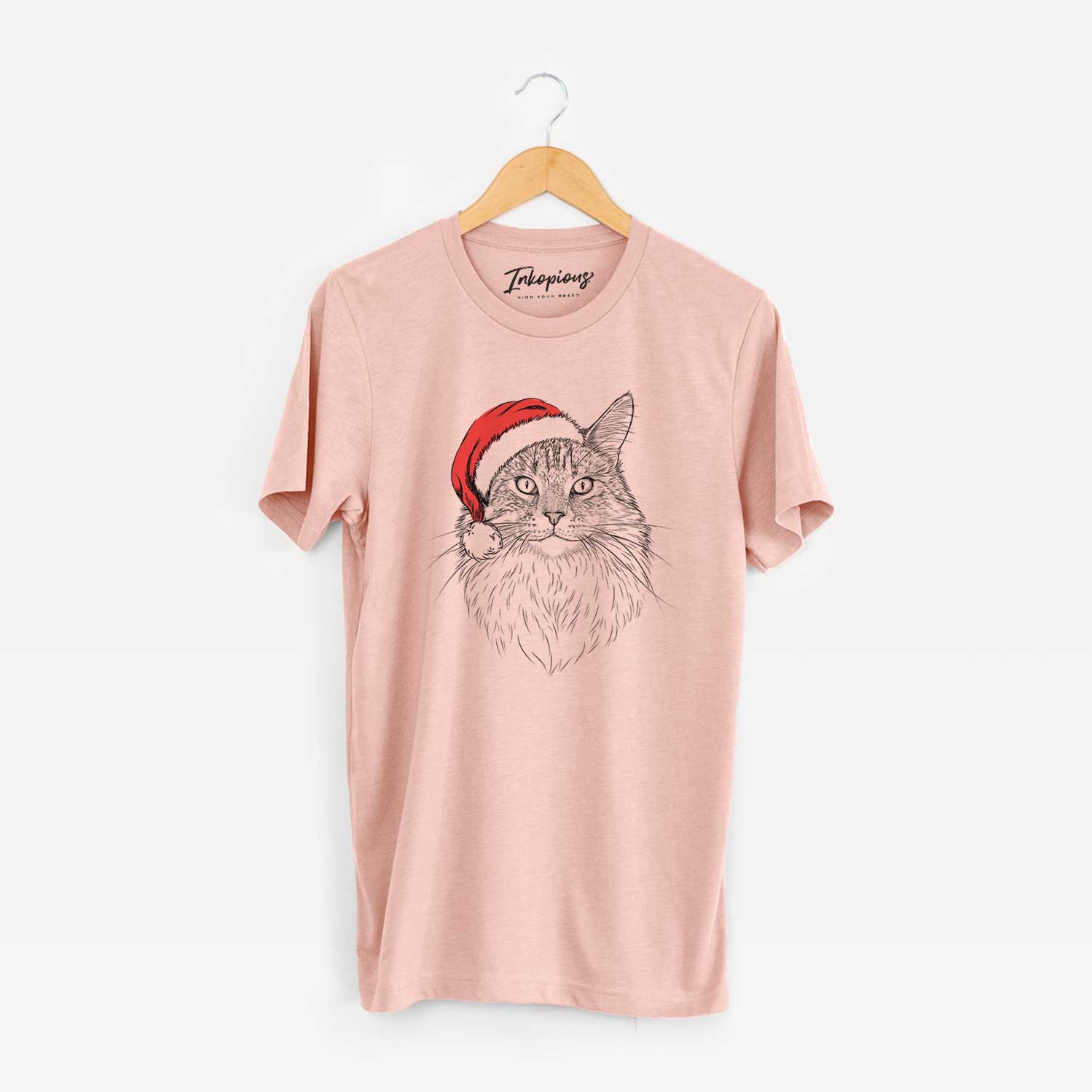 Hand-drawn sketch of Angel the Maine Coon Cat wearing a Santa hat on a Peach Unisex crewneck