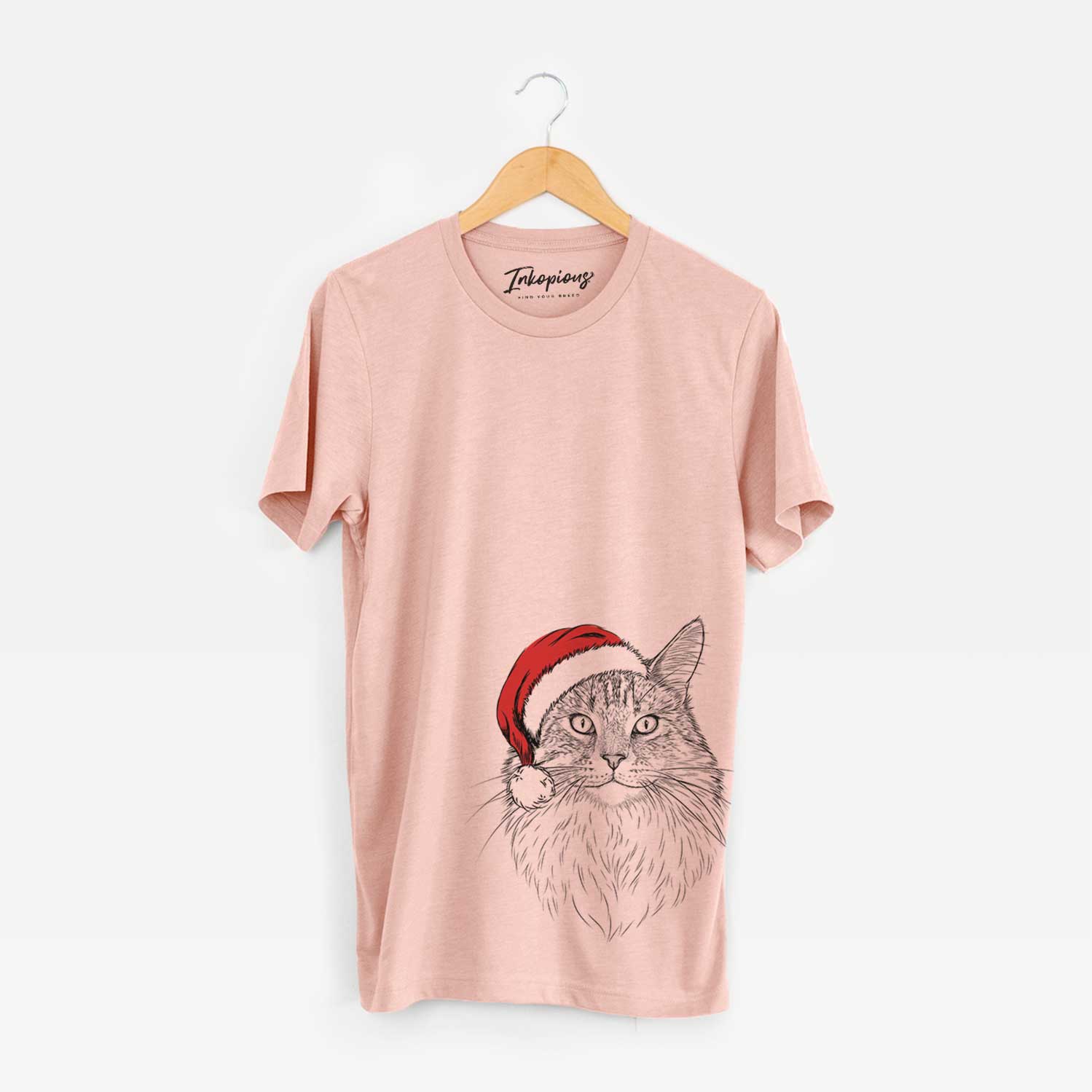 Hand-drawn sketch of Angel the Maine Coon Cat wearing a Santa hat on a Peach Unisex crewneck