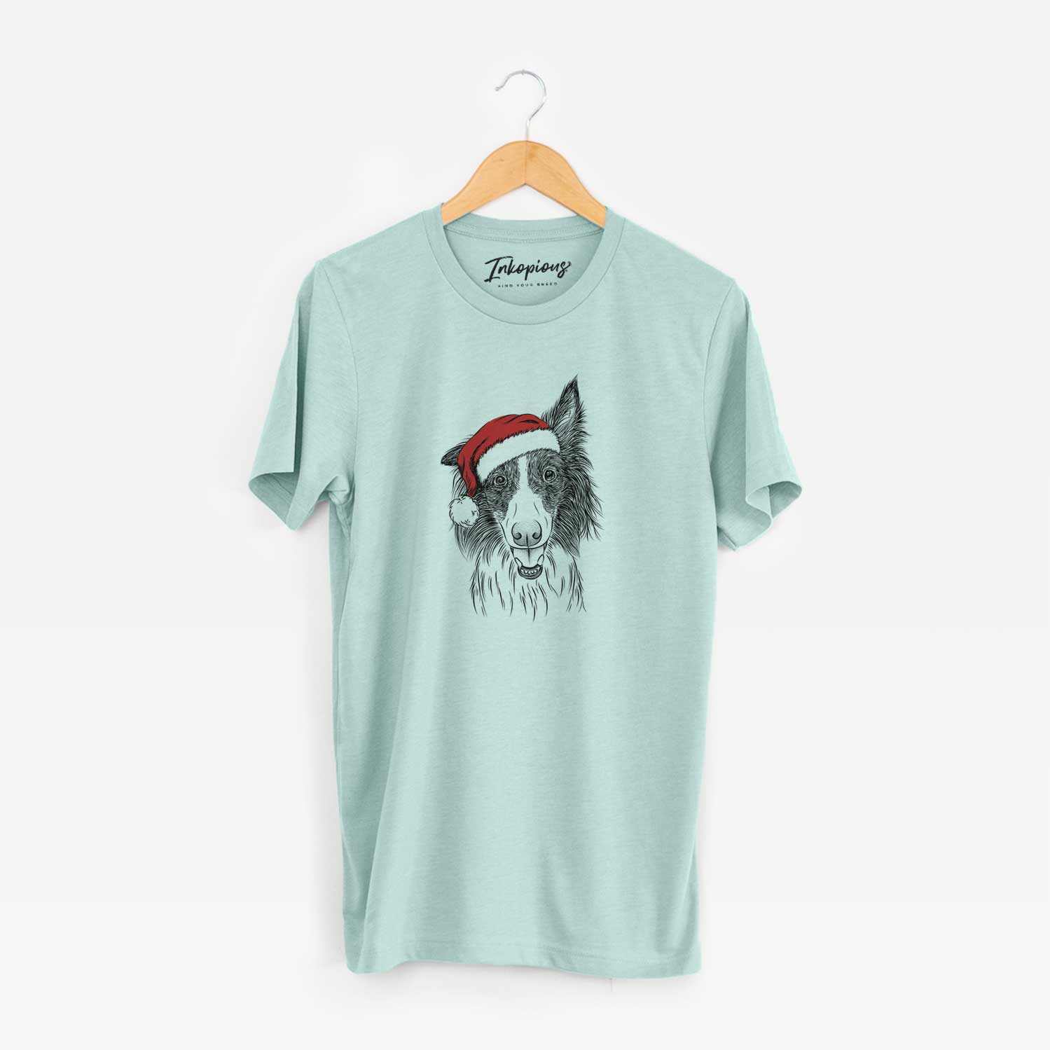 Hand-drawn sketch of Archie the Silken Windhound wearing a Santa hat on a Heather Sage Unisex crewneck