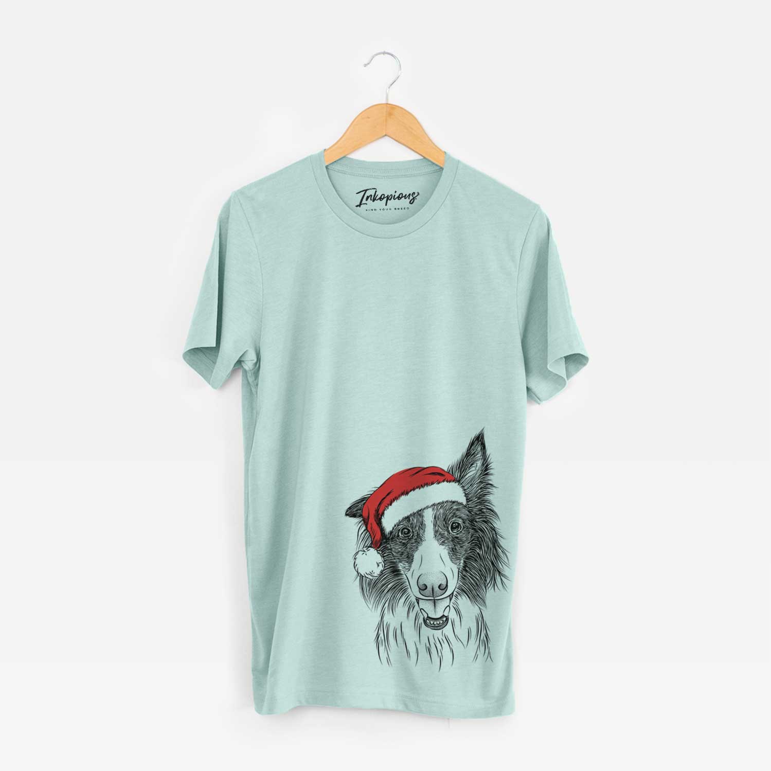Hand-drawn sketch of Archie the Silken Windhound wearing a Santa hat on a Heather Sage Unisex crewneck